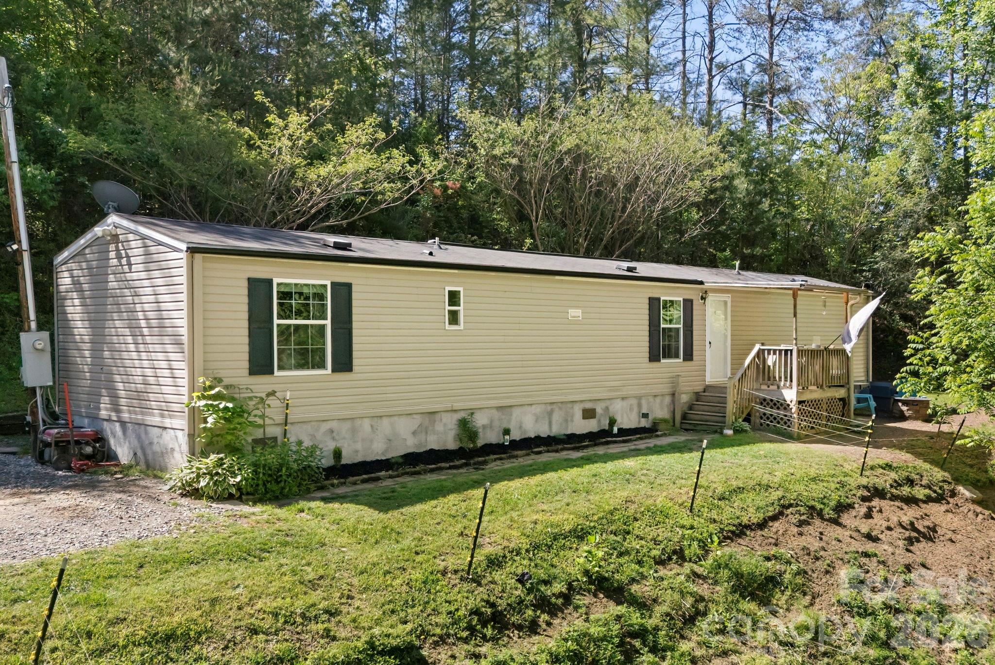 Tucked away on 1.76 private acres, this charming mobile home offers the perfect blend of peaceful country living and functional outdoor space. Surrounded by nature and set back for added privacy, the property provides plenty of room to relax, garden, or simply enjoy the quiet setting. A large fenced-in area makes it ideal for animals, pets, or hobby farming, giving you the flexibility to create your own mini homestead. Whether you're looking for a full-time residence, investment property, or mountain getaway, this property offers space, privacy, and endless potential.