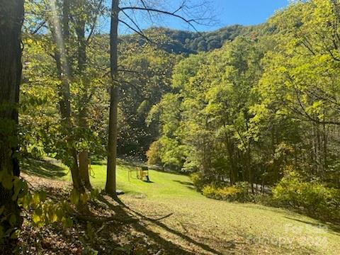 The lot is located close to the entry of the Smoky Mountain Retreat, overlooking the playground. It is a perfect location for someone that wants to be in a gated community but low on the mountain with easy access. Part of lot A-3 and lot A-2 will be combined.