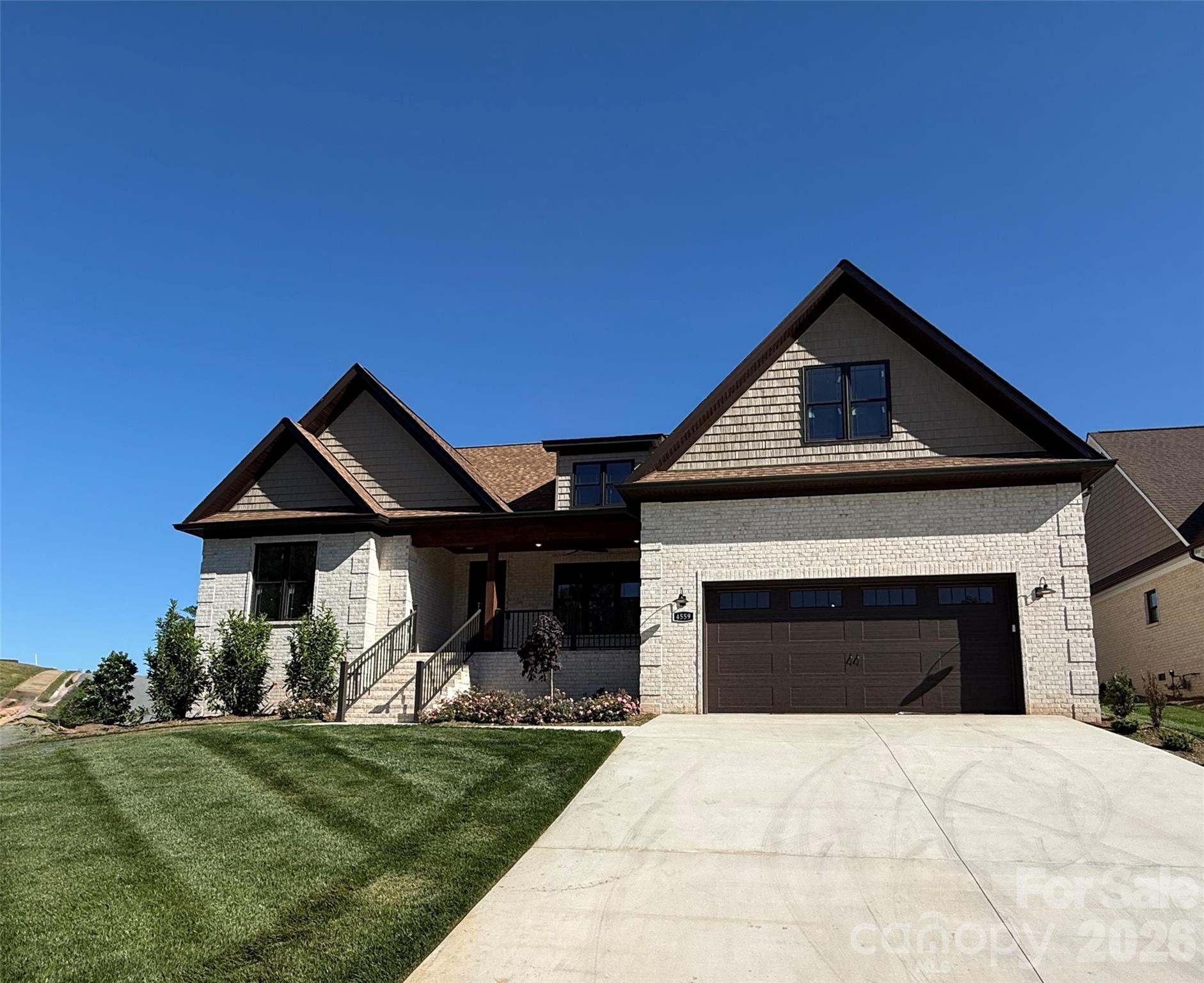 Experience the pinnacle of resort-style living in this stunning 2,791-square-foot contemporary home. Situated within the prestigious Rock Barn community, this residence offers a seamless blend of sophisticated design and the elite lifestyle that comes with living on a premier golf course.
Home Highlights
Spacious Living: 4 generously sized bedrooms and 2.5 modern bathrooms.
Premier Location: Located in the heart of Rock Barn, home to award-winning courses like the Robert Trent Jones Jr. Championship Course.
Screened-In Back Porch: The ultimate sanctuary for indoor-outdoor living. This fully enclosed space allows you to enjoy panoramic views of the manicured landscape —perfect for morning coffee or an evening cocktail.
Open Concept Design: A massive great room serves as the central hub, flowing effortlessly into the dining area and chef’s kitchen.
Architectural Focal Point: A custom fireplace anchors the main living area, providing a warm, elegant atmosphere for relaxing after a day on the links.
Refined Details: Soaring tray ceilings elevate the primary suite and main living spaces, adding a touch of grandeur and vertical depth.
Flexible Workspace: A dedicated extra room downstairs provides the perfect footprint for a quiet home office, library, or den.
Convenience: Includes a spacious attached garage with direct interior access, ideal for vehicles and golf cart storage.
The Lifestyle
Living at Rock Barn is about more than just a home—it’s about the community. Just moments from your door, you’ll have access to:
World-Class Golf: Challenge yourself on two championship courses.
The Spa: Unwind at the renowned Rock Barn Day Spa.
Amenities: Enjoy a resort-style aquatic center, tennis courts, and fine dining at the clubhouse.
This is a rare opportunity to own a meticulously designed home in one of the region’s most sought-after golf communities. Schedule your private tour today.