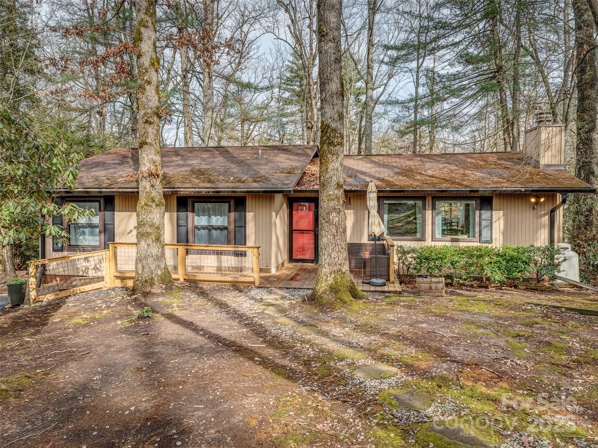 Discover peaceful mountain living just minutes from downtown Brevard at 531 Three Mile Knob Road. This well-cared-for 3-bedroom, 2-bath home sits on a beautifully wooded and private lot, offering a quiet retreat while still keeping you close to downtown Brevard. The home features a warm and inviting layout with comfortable living spaces and plenty of natural light throughout. One of the standout features is the charming sunroom, perfectly positioned to overlook the surrounding forest. Whether you’re enjoying morning coffee, reading in the afternoon sun, or simply taking in the year-round natural beauty, this space adds a sense of serenity to everyday living. The wooded lot offers both privacy and a true connection to nature, making the property feel like your own peaceful hideaway. Conveniently located just a short drive from downtown Brevard, you’ll have quick access to local shops, dining, and the vibrant arts and outdoor culture the area is known for. With its blend of comfort, nature, and convenience, this home is an ideal choice for anyone seeking a quiet mountain setting close to town amenities. Close to DuPont State Forest, Pisgah National Forest, and the Asheville Regional Airport.