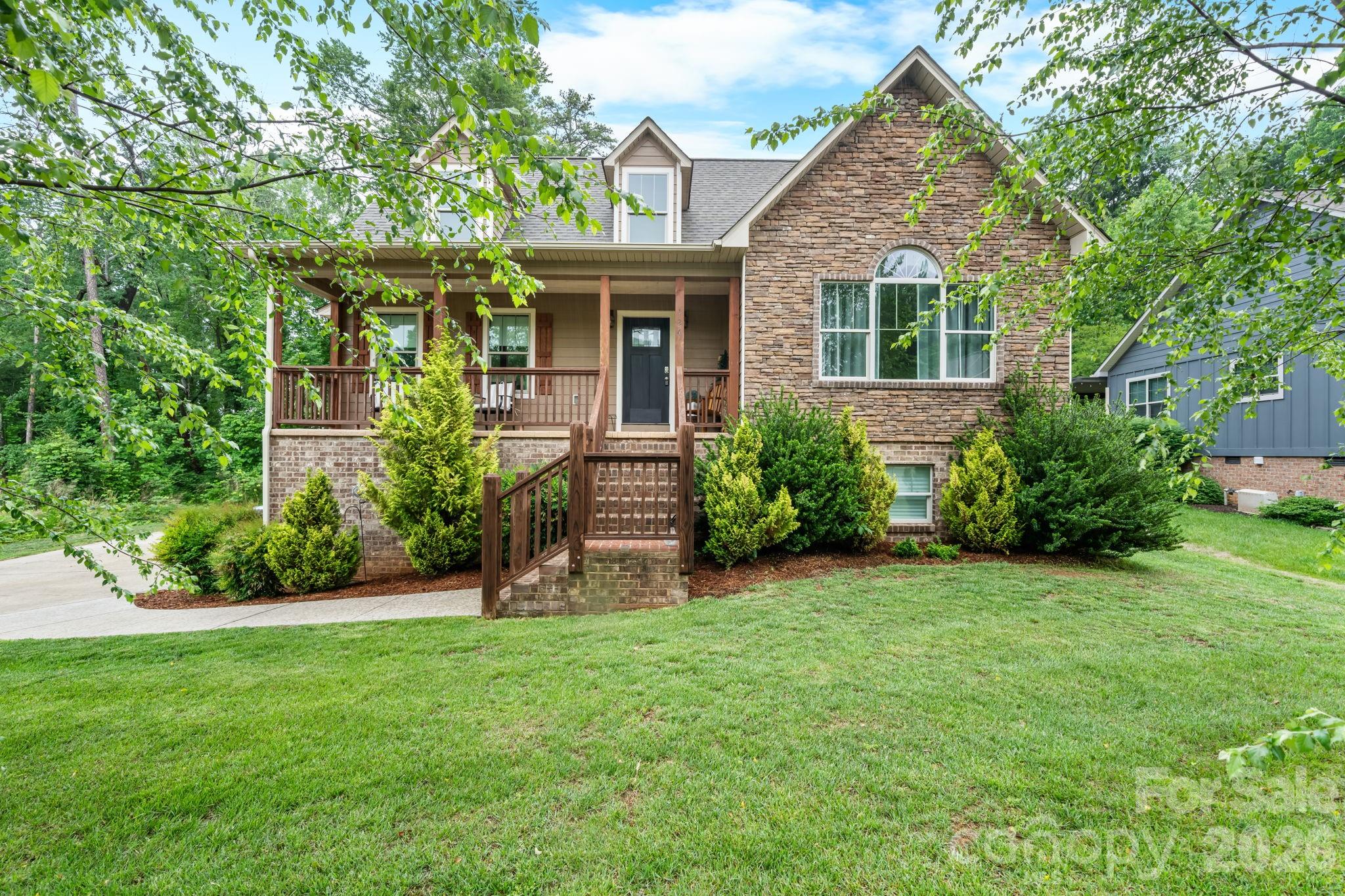 Gorgeous one-and-a-half story Craftsman-style home featuring 3 bedrooms and 2.5 baths in the sought-after Maplewood Village subdivision of Hudson. The main level offers a spacious open floor plan with towering cathedral ceilings, a cozy gas log fireplace, and abundant natural light throughout the living area. The dining area features a charming corner built-in, perfect for displaying your favorite china or providing additional storage.
The kitchen is truly a dream for any cook, complete with custom alder pine and oak cabinetry, granite countertops, an island, breakfast area, and stainless steel appliances.The primary suite is located on the main floor and features soaring cathedral ceilings, beautiful natural light, and a spacious walk-in closet. The luxurious primary bath includes granite countertops, double vanities, a soaking tub, and a gorgeous tiled shower. A convenient half bath and laundry room complete the main level. Upstairs, you’ll find two well-appointed bedrooms connected by a full bath with double vanities. One of the secondary bedrooms also includes a separate small bonus room — ideal for a home office, nursery, reading nook, gaming area, additional closet space or hobby room. The unfinished basement offers endless possibilities for future expansion, storage, workshop space, or recreation areas. Covered front porch and back deck. In this coveted subdivision, residents enjoy wonderful neighborhood amenities including desirable schools, sidewalks, walking trails, a playground, and a picnic shelter — making this one of the area’s favorite communities.