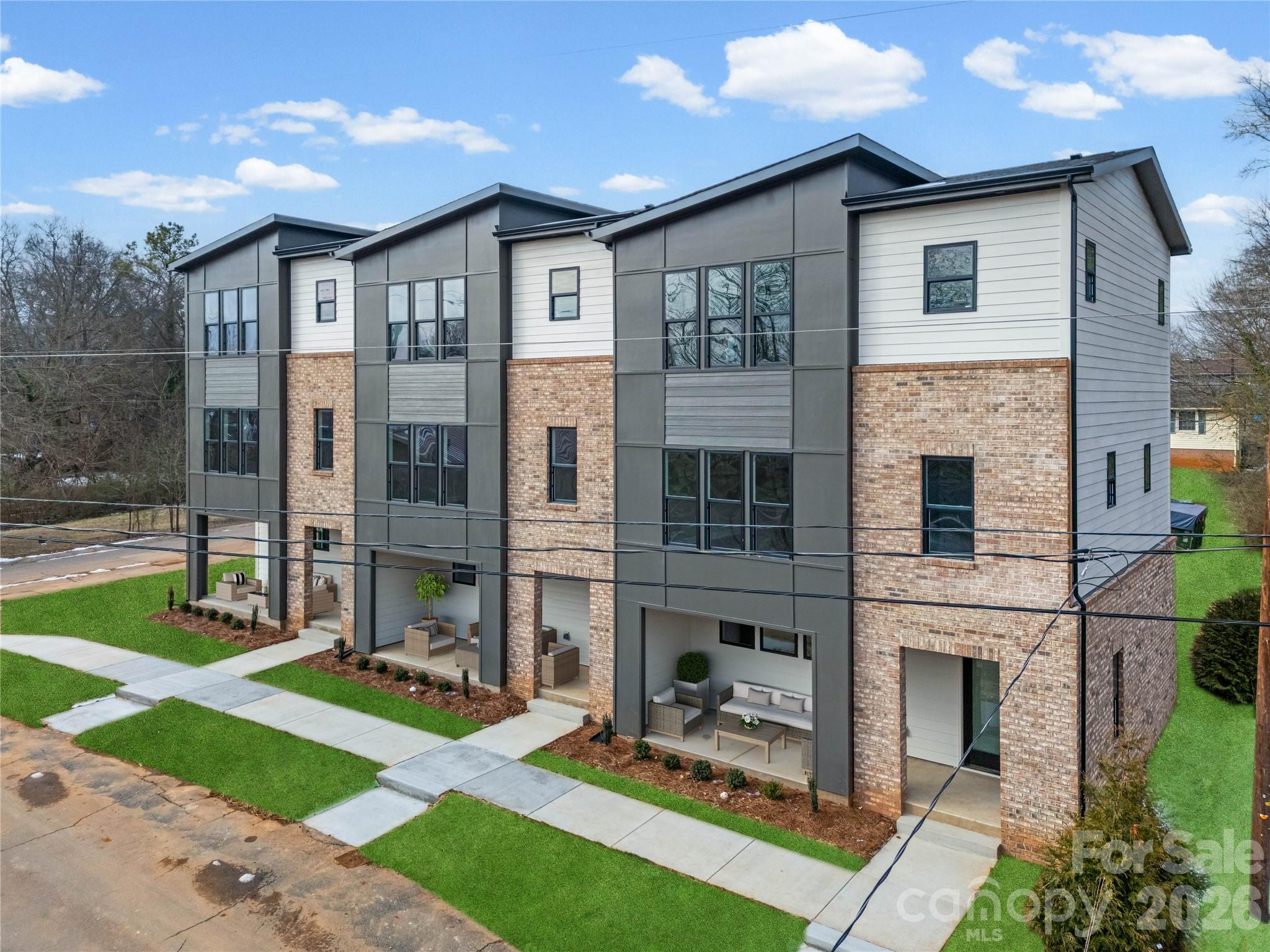 Priced 29K Below Appraisal!!! Welcome home to this custom 3-bedroom, 3 full-bath townhome with a 2-car garage, in one of the fastest growing areas just outside of Charlotte. Perfectly situated steps from the scenic Dutchman’s Creek Greenway and a short stroll to Old Mecklenburg Brewery’s newest location when completed. 
The bright and open main living level features a modern kitchen with quartz countertops, an island, and seamless flow to the dining and living areas—ideal for entertaining. This level also includes a generously sized bedroom with a full bath for easy main-floor living or a private guest suite.
Upstairs, you’ll find two true primary bedrooms, each with its own en suite bath. The first primary suite offers a walk-in closet and a luxurious bathroom complete with a large tiled shower and 10-foot double vanity. The second primary suite boasts comfortable space, abundant natural light, and its own private bath.
Relax outdoors on the covered front porch, or enjoy miles of walking and biking trails just beyond your doorstep. With modern finishes, thoughtful layout, and unbeatable access to green space, dining, and breweries, this townhome has it all!