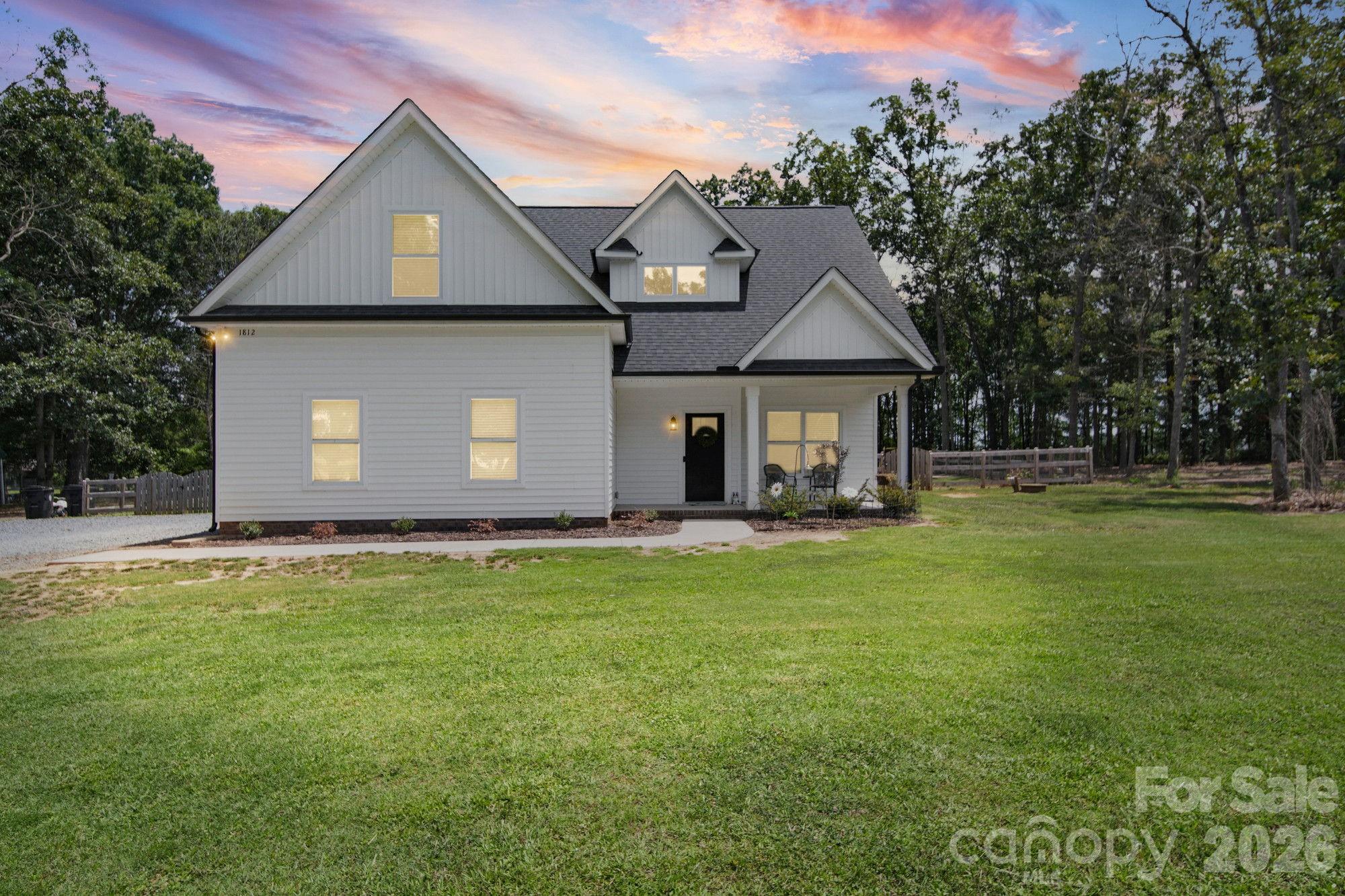 Sprawling 1.97-acre retreat in Marshville offering the perfect blend of modern luxury and country serenity! This stunning 3-bedroom, 2.5-bathroom home boasts a bright and airy open-concept layout where the spacious living area flows effortlessly into a modern kitchen deal for entertaining. Need dedicated space? The main floor features a private office perfect for remote work, while the second level offers a large bonus room ready for a home theater, gym, or playroom. Step outside to your private backyard oasis, complete with a large patio and fenced-in yard, with  of additional acreage extending beyond the fence line. Enjoy peace and privacy without sacrificing convenience, located just minutes from the Monroe Bypass for an incredibly fast commute to Monroe, Matthews, and Charlotte. A rare acreage gem with no detail spared.
