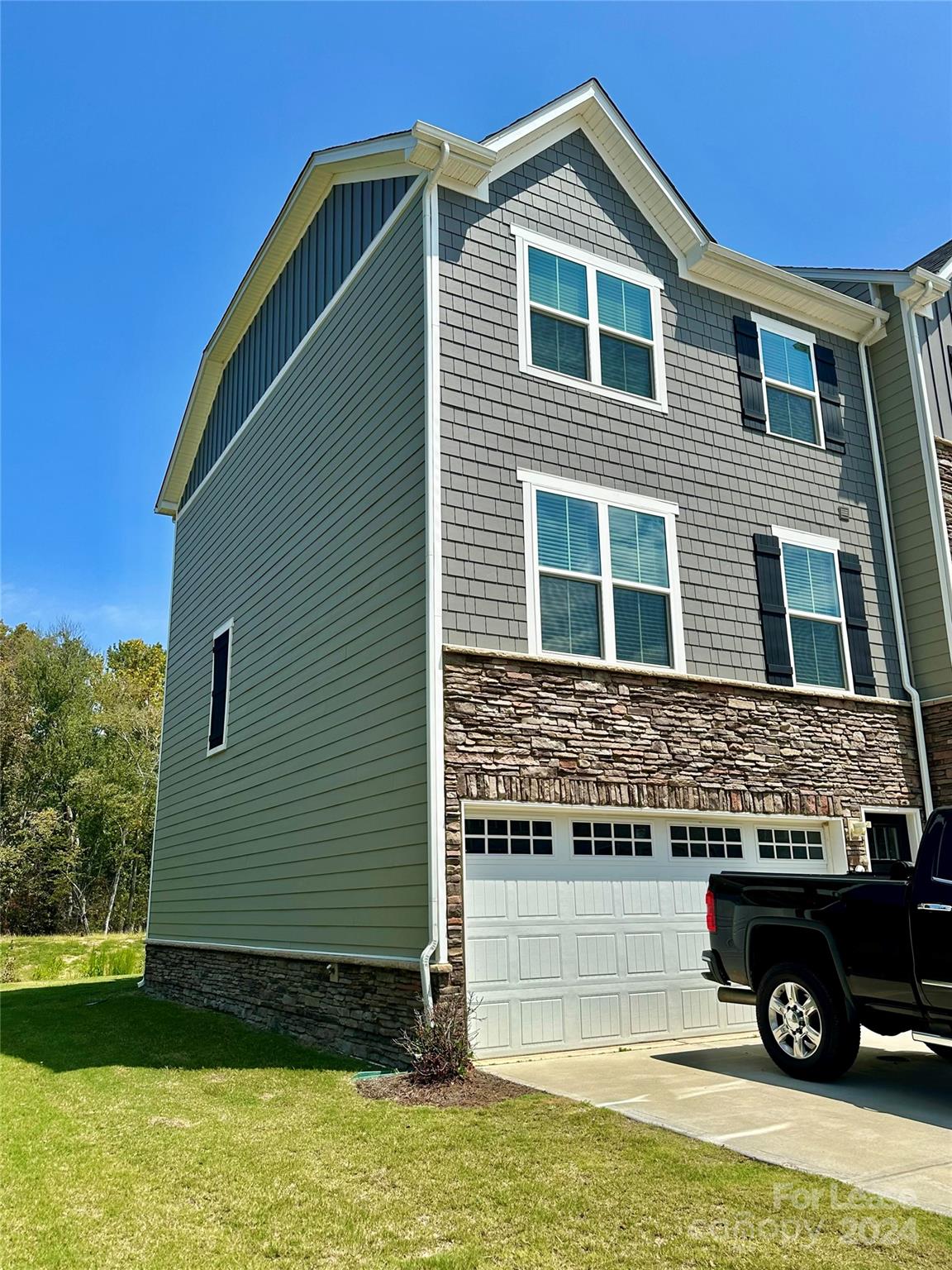Well-maintained 3-bedroom 2.5 bath end unit townhome in a wildly popular location! All bedrooms are a great size located on top level of this 3-story home. Lowest level has a large bonus/4th bedroom. You will enjoy the open concept, quartz, stainless appliances, generous storage space, 2-car garage and much more! Patio backs up to the woods with no other homes behind you. Hurry before its gone!