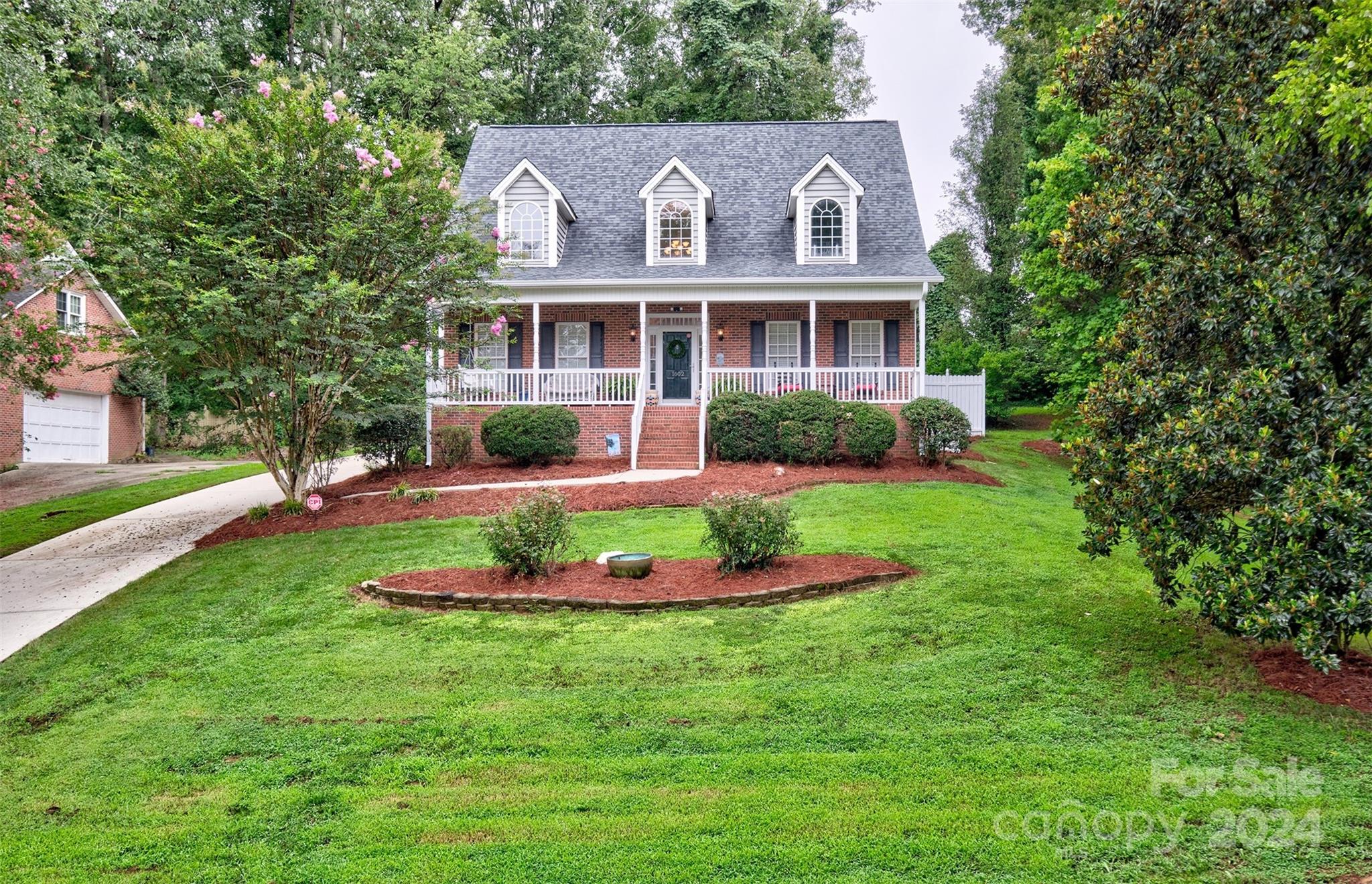 Welcome home to this warm and inviting house that is in the heart of Rock Hill and close to everything! The hospital is 1/2 mile away and Winthrop university 2 miles.  Easy access to I77 for commute to Charlotte or beyond. Open floorplan and great flow!  Tall cathedral ceilings and floating staircase are the highlight of the great room, large kitchen with tons of counter space, butlers pantry and new cooktop with downdraft.  Master on the main with dual sinks and spa like tub. 2 or 3 bedrooms upstairs with Jack and Jill bath and built in office on landing. 4th bedroom can be a bonus room .  True rocking chair front porch to enjoy! Screened in porch between the house and garage in the breezeway and small deck off the kitchen are more ways to enjoy the outdoors.  Well kept home and maintained over the years.  Brand NEW ROOF!! in the last week.1 less thing to worry about! Instant hot water heater too!  Side load oversized garage that is around the back of the house and lots of storage!