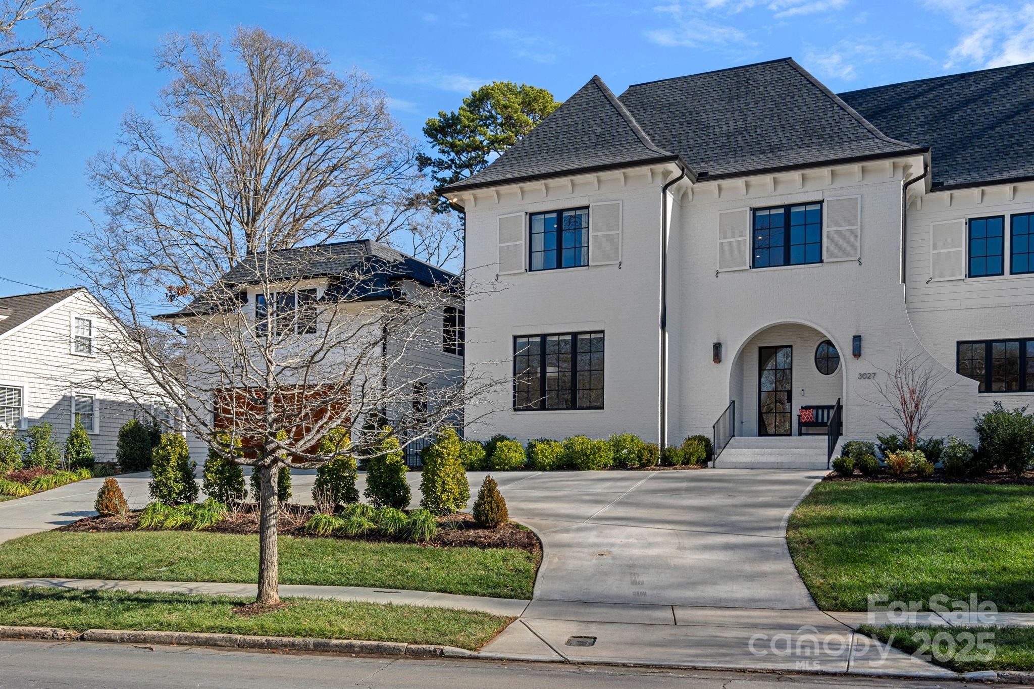 Luxury like-new THR Design Build townhome situated across from the Myers Park Greenway. Stunning light-filled open living spaces perfectly designed for relaxing at home and entertaining with ease. Gourmet kitchen includes 48” Wolf dual fuel range, custom hood, 48” Sub-Zero built-in refrigerator, walk-in pantry. Great room with built-ins flanking the fireplace opens to spacious dining room. Upper level offers serene primary suite with spa-like bathroom and custom closet. 2 additional guest rooms + laundry room on upper level. Enormous 3rd floor bonus/media room with incredible walk-in storage. Slide open the glass doors off dining room and enjoy seamless indoor/outdoor living on the screen porch with fireplace that overlooks beautifully landscaped private backyard. 2 car detached garage with finished studio/bonus room with kitchenette and bathroom. White oak floors throughout, and plenty of parking in the circular driveway. Enjoy the greenway, Freedom Park, shopping and so much more!