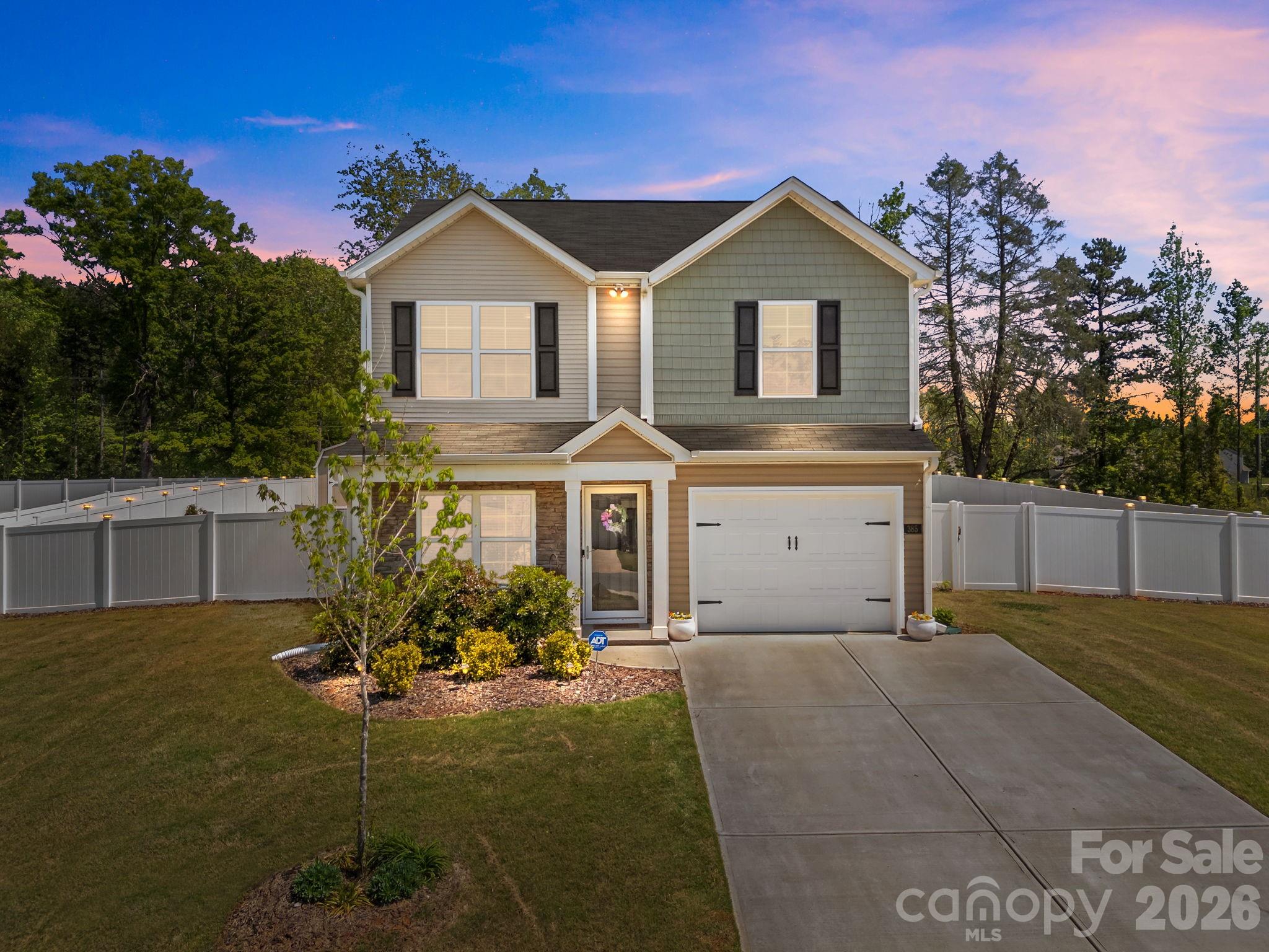 Welcome home to this beautifully built two-story residence, completed in 2023, offering modern comfort and timeless charm. A welcoming front porch accented with stone details sets the tone as you arrive. This home features a one-car garage and a thoughtfully designed layout with 3 bedrooms, 2.5 bathrooms. INSIDE, the main level boasts an inviting family room, a dedicated dining area, and a well-appointed kitchen complete with a countertop bar and spacious pantry—perfect for everyday living. Upstairs, the generous primary bedroom offers a private ensuite bathroom and an impressive oversized walk-in closet. Step outside to enjoy an extended patio overlooking a fully fenced backyard with low-maintenance vinyl fencing. A large outbuilding provides ample additional storage. Conveniently located in the county, while remaining close to highway access, shopping, and just a short drive to High Rock Lake. A fantastic opportunity to enjoy modern living!