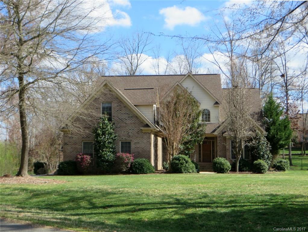 Picture perfect setting! Gorgeous custom home on meticulously landscaped 1 acre corner lot. Large screened porch, deck & hot tub, deep backyard w/wrought iron fencing, irrigation. Hand-scraped wide plank HWs thru ENTIRE MAIN LEVEL & newer carpet in upstairs BRs (< 2yrs), tile in baths. 2 story Foyer & GR w/gas fireplace. Extensive moldings & trim, vaulted & tray ceilings. Deluxe Master Suite + guest suite on main. 2 more BRs, bath & XL Bonus up. Designer lighting & paint throughout. IMMACULATE!