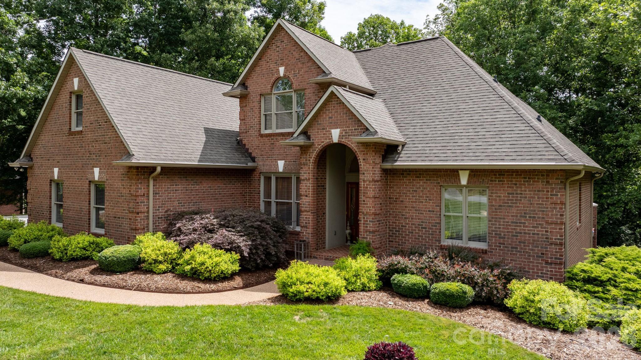 Located in the highly desirable Springwood neighborhood, this immaculately maintained executive-style home is ready to impress! Step inside to a stunning two-story foyer filled with natural light. Just off the foyer, you'll find the open, vaulted formal living and dining rooms—perfect for entertaining or everyday living. The spacious main-level primary suite features an expansive en-suite bath and a walk-in closet. The inviting family room, centered around a cozy fireplace, flows seamlessly into the kitchen, creating the ideal gathering space for family and friends. Beautiful hardwood floors and staircase lead to three additional bedrooms, a full bath, and a finished flex space that can easily serve as a home office, media room, playroom, exercise room, or whatever fits your lifestyle. The full basement is exceptionally clean and offers endless possibilities for storage or future finished living space. An oversized two-car garage provides plenty of room for vehicles, storage, and all the essentials. Every detail of this home has been thoughtfully maintained, creating an exceptional opportunity for comfortable executive living. Springwood also offers a pedestrian-friendly neighborhood, perfect for evening walks and enjoying the community.