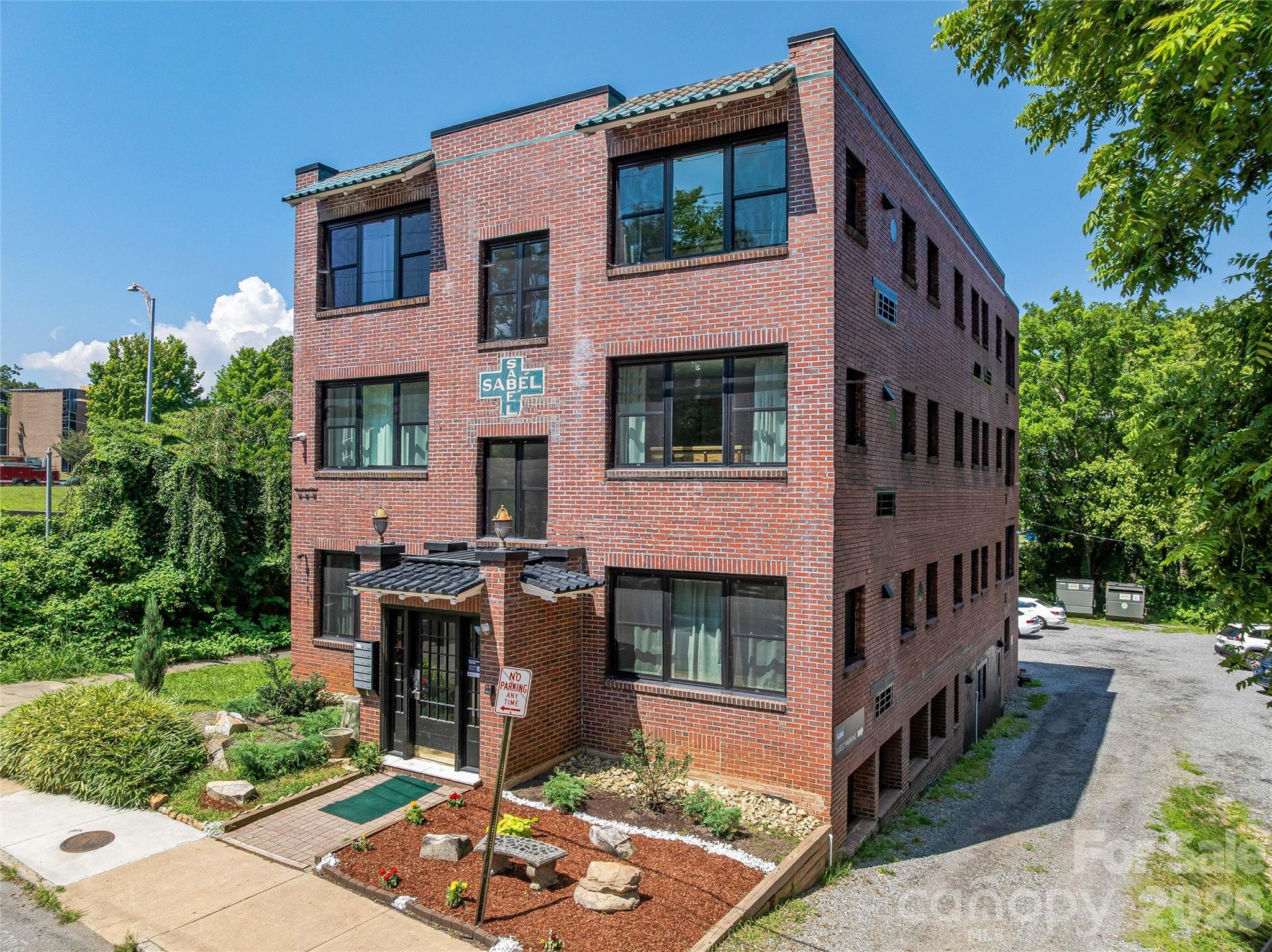 42 Furman Avenue represents one of the most compelling short-term rental investment opportunities in downtown Asheville—a fully licensed, purpose-built 16-unit STR asset in a market where new permits are no longer issued. Spanning approximately 8,395 square feet across three stories plus a walkout basement, the building was completely renovated to the studs and redesigned specifically for short-term rental use, delivering modern interiors, efficient layouts, and strong visual appeal for today’s guest expectations. The unit mix includes twelve one-bedroom units and four studios, all configured to maximize occupancy and revenue potential. Located less than a mile from Asheville’s core attractions—including its nationally recognized dining scene, River Arts District, and cultural amenities—the property benefits from consistent year-round demand. With dedicated parking, an active and compliant STR license, and a structure that cannot be replicated under current regulations, this asset offers a rare combination of scale, location, and operational upside for an investor seeking to establish or expand a presence in one of the Southeast’s most resilient short-term rental markets.