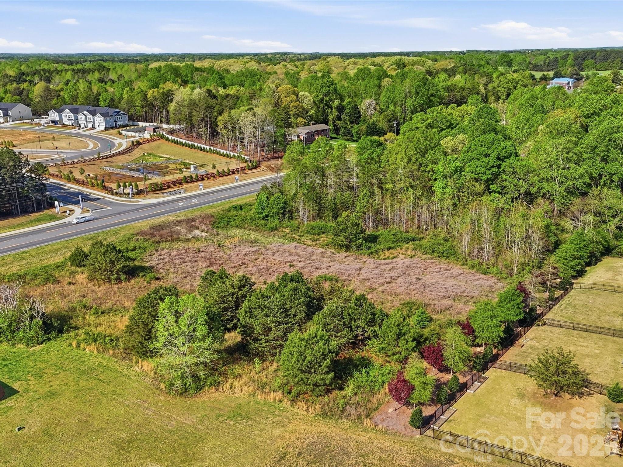 Prime opportunity to secure a high visibility commercial lot in a rapidly growing area. Offering over 2 acres and located within city limits, this property is zoned B-2, allowing for a wide range of commercial uses making it an ideal investment for developers, business owners, or those looking to expand their portfolio. Strategically positioned with excellent road frontage and easy access, the property benefits from strong traffic flow and outstanding exposure, providing maximum visibility for future development. Surrounded by established businesses and ongoing growth, this location supports both immediate opportunity and long term appreciation. With ample space to bring your vision to life, this versatile parcel presents endless possibilities for retail, office, or mixed use development. Interested parties are encouraged to confirm availability of utilities to suit their specific needs. Don’t miss this chance to secure a prime commercial property in the thriving and expanding market of Clover SC!