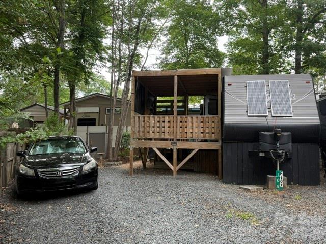 Great 2019 Pioneer Travel trailer 2 bedroom, 1 bath, very private setting tucked away in a quiet cul-de-sac location.  Storage building has lots of room even a 1/2 bath shower and toilet tucked away inside there.  Partially covered deck and uncovered lower deck.  This place is super cute, so much extra to this spot.  Solar Ecco Flow System with two solar panel in current use, also has a Predator Generator in use when needed wired into camper for use if needed.