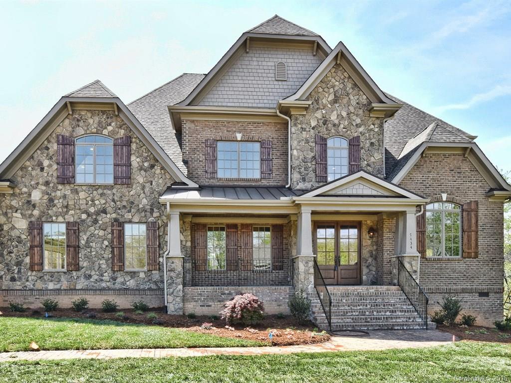 Impressive new custom built home in gated community of Longbrooke. 1st floor Owner's Suite w/dbl tray ceiilng & spacious en-suite. Re-designed custom kitchen w/Maple Java cabinets, granite, oversized island, SS Bosch appliances, private office off kitchen, mudroom. Family room with coffered ceilings, stone veneer fireplace, multi width hardwood flooring throughout main floor. Craftsmanship, details & upgrades at every turn. Spacious secondary bedrooms, media room & addt'l playroom upstairs.