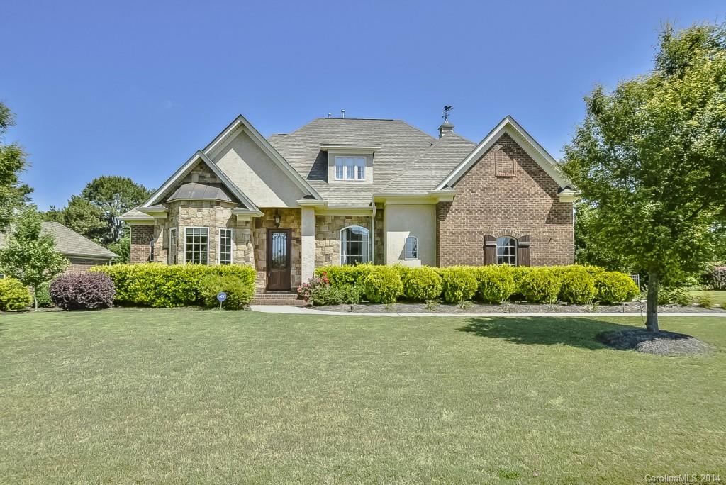 Come see this gorgeous custom home in Fort Mill!  This 4 bed/3.5 bath house (+theater) has upgrades galore, incl.custom moldings, gas fireplace in great rm, site-finished dark cherry hardwoods and hand scraped teak on the main, granite counters, stainless appl, Jenni-air gas stove/grill, and more. There are two masters with en suite baths, fenced yard w/ irrigation system, large deck and pergola.
