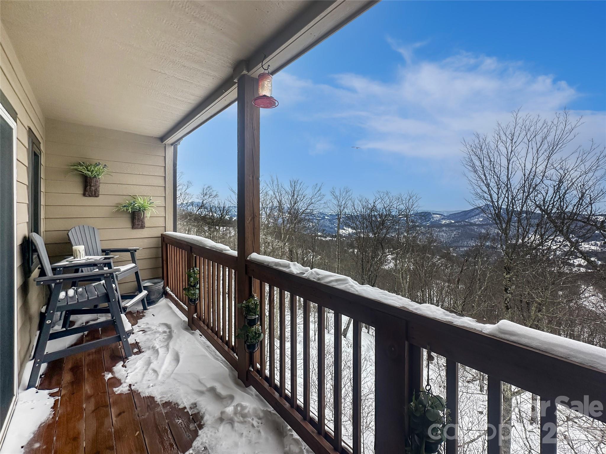 Top-floor, easy-access, and packed with panoramic views—Sugar Ski & Country Club Unit 232 is a turnkey 2BR condo with sweeping long-range views over forest and mountain ranges (no condo building is below this one). The open-concept kitchen/living area is made for après-ski and entertaining, featuring bar seating, a dining area, adjacent living room with a flat screen TV, and an updated electric fireplace, with views from the open living area. Recent updates throughout plus sold fully furnished make this an effortless move-in or rental-ready opportunity. Set at approximately 5,000’ elevation, enjoy cool summer escapes and snowy winter stays. Ski-in/ski-out convenience means you can walk to the slopes from Unit 232, then return to a comfortable layout with large bedrooms and a washer/dryer for added practicality. Sugar Ski & Country Club’s Clubhouse (opened May 2021) offers an indoor heated pool, hot tub, sauna, and fitness room, plus tennis/pickleball in the warmer seasons. Enjoy outdoor grills and picnic tables near each building, all within a gated community with on-site management. Minutes to year-round High Country attractions—golf, hiking, biking, an alpine rollercoaster, Grandfather Mountain, the Blue Ridge Parkway, and more. A true mountain getaway—ready to enjoy from day one. Owner is a licensed REALTOR.