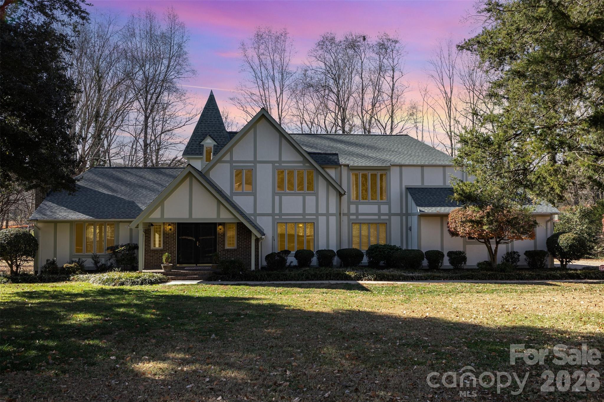 FRESH PAINT means a BLANK SLATE! Make this beautiful home in sought-after Country Club Gardens your own!  This timeless, traditional home sits back from the road on a large ~1 acre lot with a creek! Enjoy peaceful living just minutes to Uptown Shelby, Cleveland Country Club, and Hwy 74 businesses! Main level has great flow with large doorways connecting the common areas. Spacious family room with gas log fire place connects to large dining room. There is also a separate den or home office that has two separate doorways. A covered porch off of the dining room will become one of your favorite places, and this leads to a deck overlooking the creek, neighboring pond, and back yard. The spacious kitchen has granite countertops and stainless steel appliances. There is a center island and a breakfast area w/ additional breakfast bar and tons of cabinet space. A spacious laundry closet is located in the heart of the home making chores convenient!  The main level also has a full bathroom and bedroom with direct exterior access to a 2nd covered back porch--this would be a perfect 2nd living quarters for extended family or guests. Upstairs, you will find a large primary bedroom with en-suite bath and separate dressing room/closet area. There are two additional bedrooms that share a hall bathroom. An upstairs bonus room provides an additional common area or could be a separate home office. Attached two car garage and additional great storage options throughout the house! Updates include neutral interior paint, popcorn ceiling removal, replacement of carpet w/ hardwood floors, and new upstairs HVAC in 2024. Sewer easement in back yard and small encroachment on driveway side. See docs for details. Please call now for more information!!!