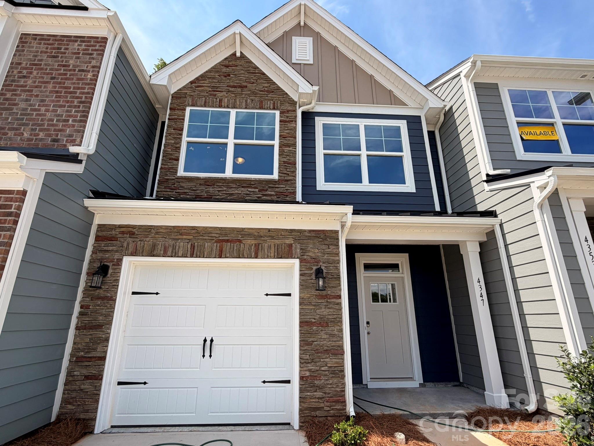 New townhomes in Harrisburg! This Ashland plan has 3 bedrooms, 2.5 baths, and more than 1,800 square feet of living space. The beautiful kitchen has Shaker-style, gray cabinets, white quartz counters, white tile backsplash, and stainless appliances, including a gas range. The kitchen opens into the dining area and family room, which opens to the covered porch. Stairs with metal balusters lead to the upper floor that has a loft, laundry room, two secondary bedrooms, a hall bath, and the spacious primary suite. The primary bath has a tiled shower with a bench seat, dual-sink vanity, and a linen closet. All bathrooms feature gray cabinetry and white quartz counters. Additional extras include a foyer with tray ceiling and a built-in, beadboard drop zone. Community amenities feature a dog park, playground, paved walking trail, outdoor pool & cabana.