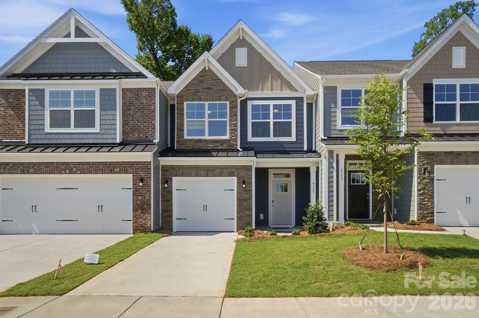 New townhomes in Harrisburg! This Ashland plan has 3 bedrooms, 2.5 baths, and more than 1,800 square feet of living space. The beautiful kitchen has Shaker-style, gray cabinets, white quartz counters, white tile backsplash, and stainless appliances, including a gas range. The kitchen opens into the dining area and family room, which opens to the covered porch. Stairs with metal balusters lead to the upper floor that has a loft, laundry room, two secondary bedrooms, a hall bath, and the spacious primary suite. The primary bath has a tiled shower with a bench seat, dual-sink vanity, and a linen closet. All bathrooms feature gray cabinetry and white quartz counters. Additional extras include a foyer with tray ceiling and a built-in, beadboard drop zone. Community amenities feature a dog park, playground, paved walking trail, outdoor pool & cabana.