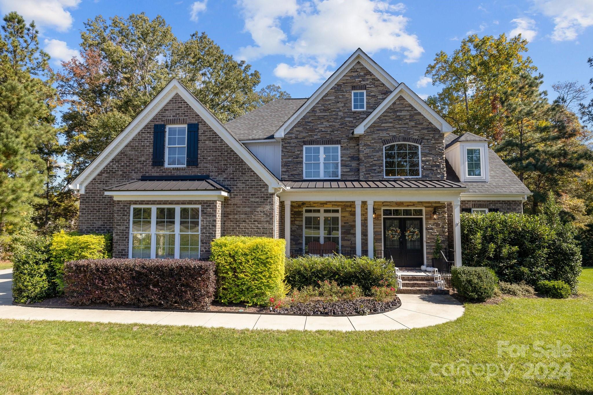 Don't miss the opportunity to own this home in the well sought after Millstone Creek neighborhood.Welcome to this stunning 4 bedroom,3 bathroom retreat nestled on a private, wooded acre.This spacious home blends comfort with nature,offering an open-concept layout that brings the beauty of the outdoors in.Windows provide natural light and provide views of mature trees that surround the property.The main floor features a generous living area with a cozy fireplace, a modern kitchen with stainless steel appliances,beverage cooler and granite countertops.The primary bedroom suite offers a luxurious en-suite bathroom with double vanity,spacious shower and large walk-in closet.On the main level is an additional suite with attached bathroom.The remaining bedrooms upstairs provide ample space for family,guests,or a home office.You'll also find on the second floor a sizeable bonus room.Enjoy the firepit outside on your paver patio or an evening on the screened in back porch.