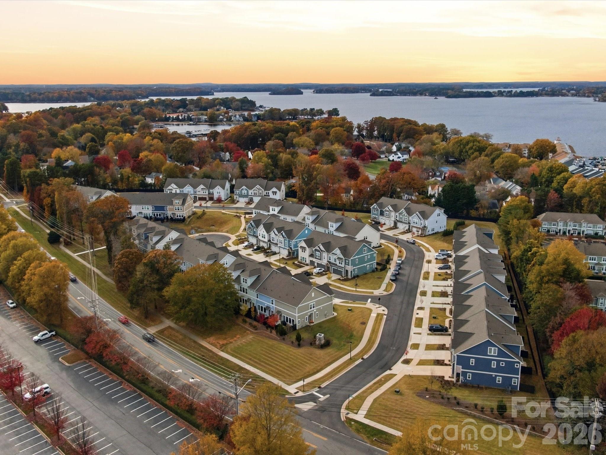 TAKE ADVANTAGE OF LAKE SEASON, and buy this 2023 David Weekley home, with THE BEST PRIMARY SUITE LAYOUT I HAVE EVER SEEN!!!  Do you have a boat or want a boat?  Because the boat ramp and possible boat storage, is only a 120 second drive away!  And now it’s also the best priced unit in the neighborhood!  Welcome to your "like new" townhouse located just 1 mile from Birkdale Village, where Lake Norman is basically in your backyard.  This home has a 2-car garage, extended patio for entertaining, 3 bedrooms with each room having their OWN BATHROOM, a big loft on the 3rd floor where bedroom 3 is located, halfbath on the first floor, BEAUTIFUL herringbone backsplash in the kitchen, gas burner stove, etc etc.  Now----THE PRIMARY:  There are 2 HUGE walk-in closets, with a bench and a mirror in-between, perfect for getting ready, a bathroom so big that 6 people could do jumping jacks at the same time, AND....the laundry room is "jack and jill" style and opens up right across from the primary closets!!!  It's genius.  Pure genius.  Refrigerator and washer/dryer convey.  Contact listing agent with any questions.