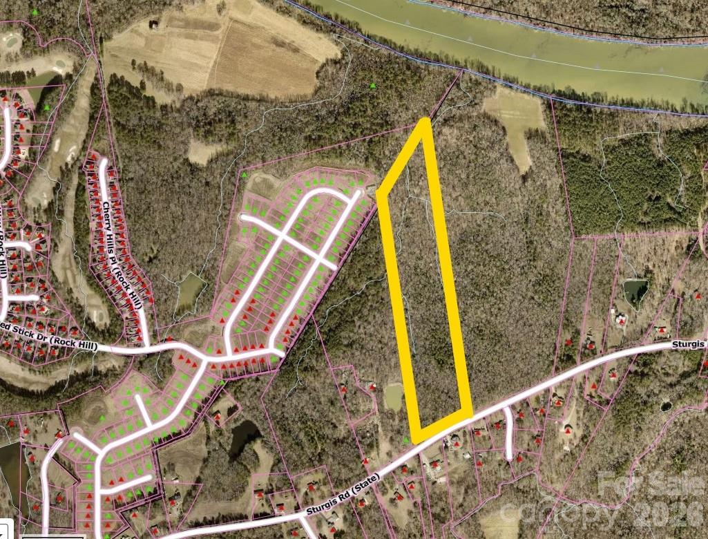 Finding over 22 acres this close to the heart of Rock Hill is getting harder every day. This expansive tract on Sturgis Road offers a unique opportunity to create something special, whether you are envisioning a private residential retreat or the area’s next thoughtfully designed development. One of the biggest hurdles for large-scale projects is already cleared here, as you have the rare ability to tie directly into city water and sewer (with annexation). Located less than 10 minutes from I-77 and the area's premier shopping and dining, the property offers a peaceful rural feel without sacrificing convenience. While a portion of the land features the preferred Cecil series soils known for great engineering and development properties, the back of the property offers a peaceful natural border with a small creek and floodplain area. The current York County RUD zoning provides a solid starting point, and the seller is even willing to work with you on zoning changes to help bring your specific vision to life. This is more than just a listing; it is 22.48 acres of potential waiting for the right footprint.