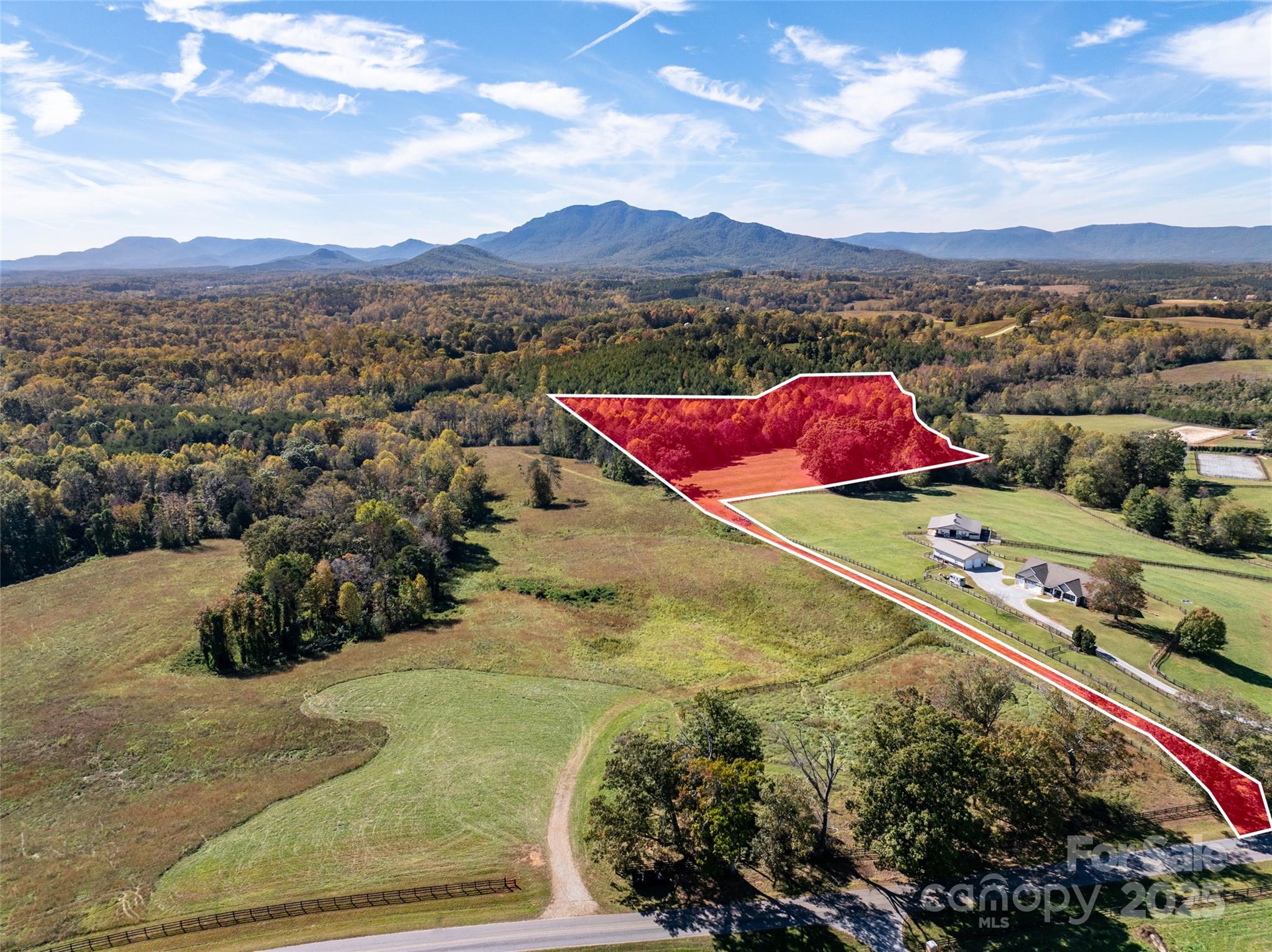 Tryon Equestrian Farms is a 1000-acre subdivision sited on gently rolling pasture land in the foothills of HORSE COUNTY in the Blue Ridge Mountains. Lot 27 is 15.68 acres that offers long-range mountain views pastures and wooded areas. Come build your new dream home, barn, and riding ring on this gorgeous lot. This is truly a prime location just 10-15 minutes from Tryon International Equestrian Center. TIEC offers unmatched equestrian resources and events. Nature and bridle trails are recorded on the plat throughout the subdivision. Plus, a future community space with a hitching post, shade shed, and water for the horses.