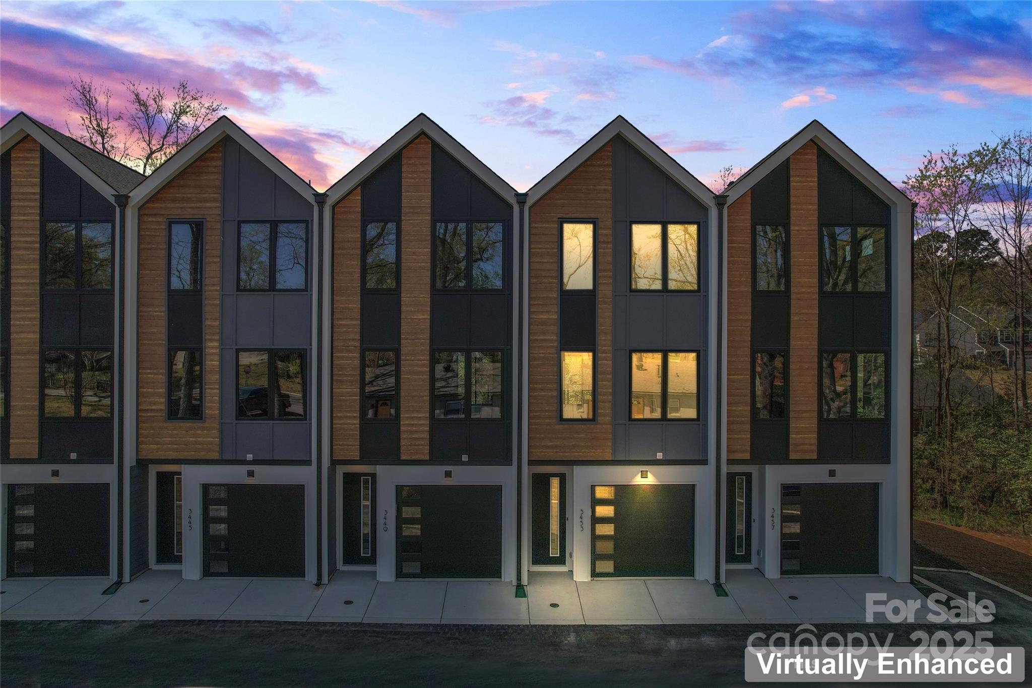 Last unit left! Closeout Pricing!  Live near NoDa, enjoy a walkable neighborhood, and short 10 minutes drive to uptown and all that Charlotte has to offer!  First floor entry with 2 car garage and private en suite.  Upstairs offers a show-stopper chef's kitchen with extra large quartz island with seating, range hood, modern gold accents, microwave drawer, sleek finishes and a separate dining area.  Large gathering room with powder and balcony. Upstairs, enjoy a retreat  with an impressive large primary bedroom, spa-inspired bath, and generous walk in closet. Another bathroom and full bathroom for convenience.  Home includes upgraded features such as dual stairs, Revwood flooring, designer selections, and Sherwin-Williams paint.  Smart features include a Ring Doorbell, myQ garage door opener with camera, and wireless thermostat. The perfect mix of trend, location, and low maintenance luxury,