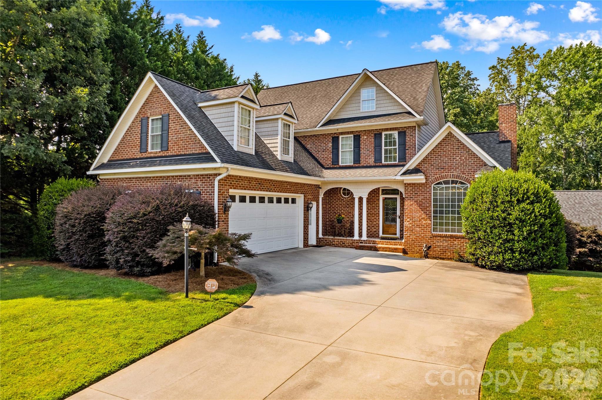 Welcome to 158 Winding Brook Way — where space, style, and versatility meet. This beautiful 3 bed, 3.5 bath home features a main-level primary suite, a cozy living room with gas log fireplace, a well-equipped kitchen with stainless appliances, custom cabinets, and granite countertops, a sunny breakfast area, and separate dining area. Upstairs offers spacious bedrooms with a Jack-and-Jill bathroom and a large bonus room. The full, partially finished basement includes a second kitchen, bonus room, full bath, family room, study, and flex space—perfect for extended living or guests. With interior and exterior access, this is the perfect for multi-generational living. 2-car attached garage plus a large detached 1-car garage/shop with finished bonus room above. Relax on the covered porch, back deck, or patio overlooking the peaceful yard with lots of shade trees. Amazing location that is convenient to shopping, dining, award-winning schools, and major interstates.