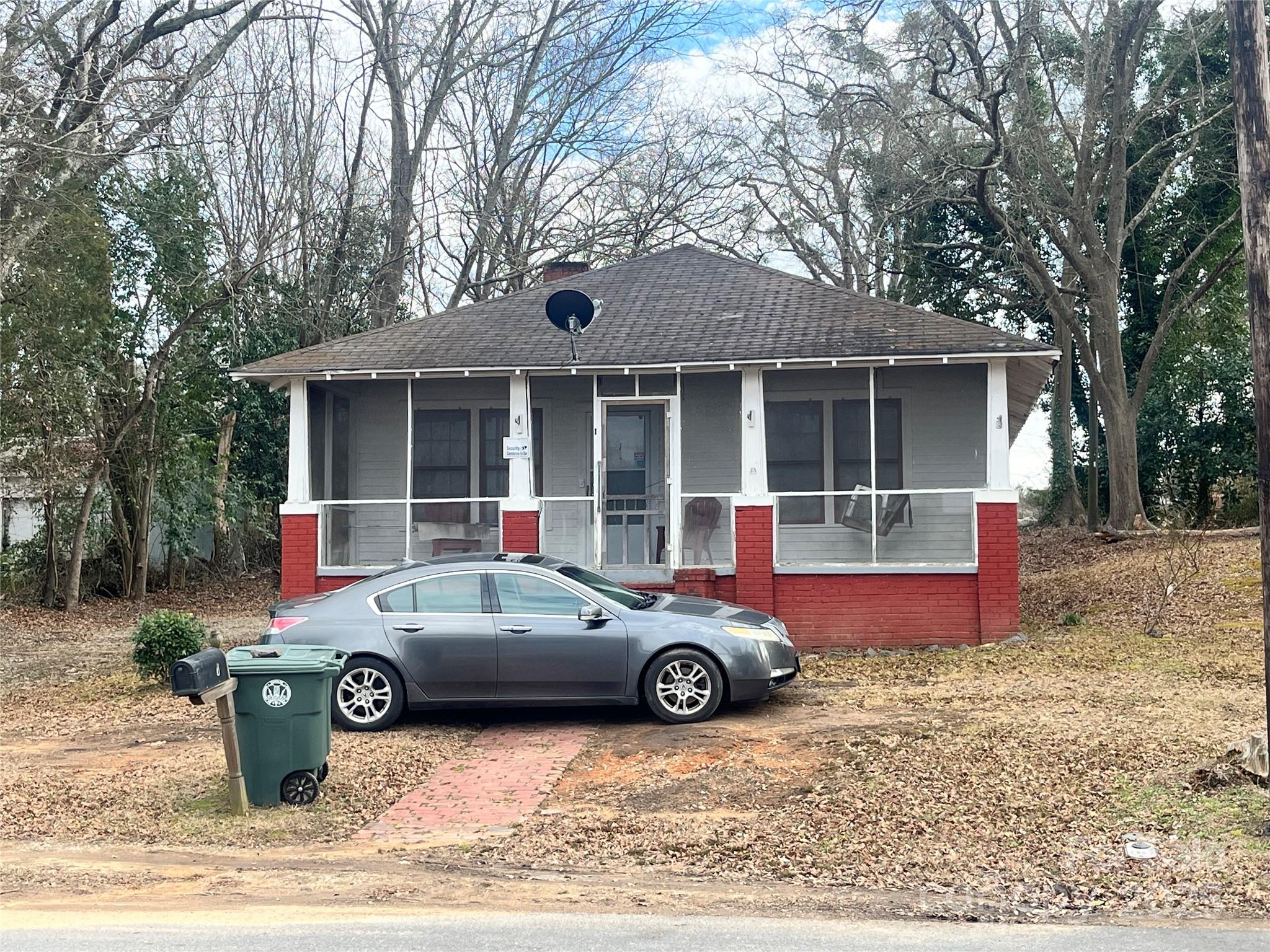 This 3-bedroom home in Great Falls, SC, offers approximately 1,176 sq ft of living space (per tax records). The property includes a screened front porch and is located close to the local grocery store for added convenience. Please note this property is tenant-occupied, and showings are not allowed. Do not disturb the tenant. The home is being sold in as-is condition, sight unseen.