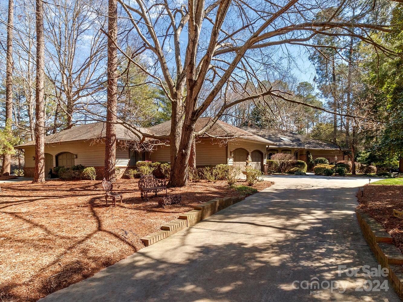 Welcome to this beautiful custom built and spacious ranch home on a 0.5 acre lot in a quiet culdesac. Upon entering the lovely foyer you will see the beautfiul great room with fireplace, formal dining room, kitchen, breakfast area, and a separate den. The spacious primary suite boasts 3 walk-in closets, and the bath area has a large garden tub, large shower, and dual vanities. From the primary suite you can access the large screened porch. There are 2 additional BRs with a connecting bath at the other end ot the home. The oversize laundry room can also be a craft/sewing area, w/stairs going to the attic. You will never have to worry about storage in this home. The 28x12 screened porch on the back opens to a 26x13 deck. The house features 2 double garages that are heated and air conditioned, and accomodate 4 cars. They are connected by an office and workshop. Under the house are 2 large rooms for storage. Homeowners spared no expense when building and have lovingly maintained this home.