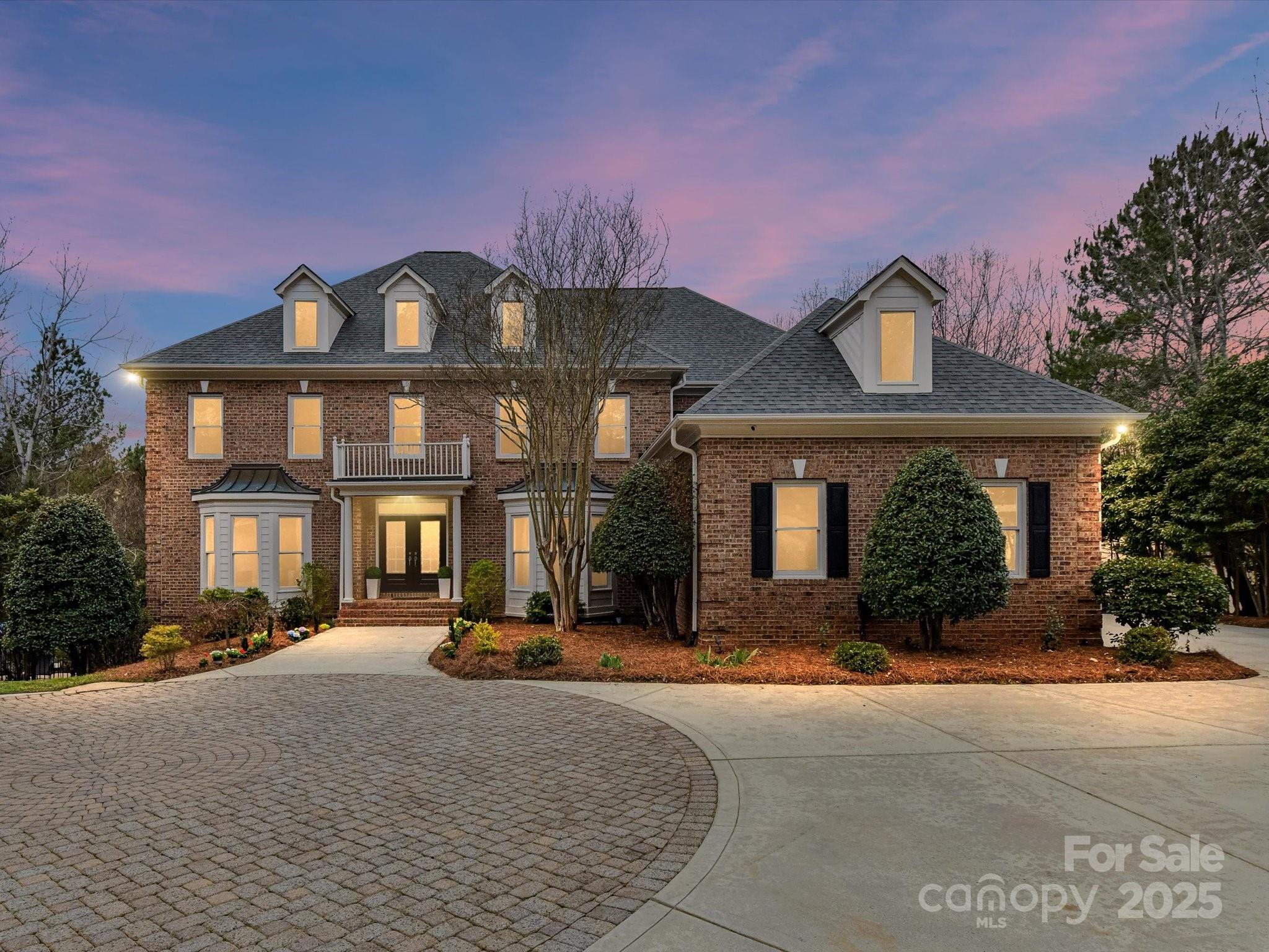 Stunning renovated estate on 1.27 acres in BCC-perfectly positioned on a rare double lot & private cul-de-sac overlooking hole#16, this exquisite Simonini-built estate has been newly renovated w/ chic lighting, new & refinished hardwood, new carpet, tile, LVP, fresh premium paint, & enhanced landscaping. Featuring 6 beds, 7/2 baths, and garages with 5-car capacity, this home offers an open layout filled w/ natural light and exceptional craftsmanship. The main level boasts a two-story foyer, grand GR, gourmet kitchen w/ double islands, and a guest suite. Upstairs, the primary suite offers a sitting area, spa-like bath, and walk-in closet, as well as 3 additional bedrooms & ensuite baths. The finished walk-out basement includes a 2nd living area, bar, flex space, and guest suite. Outside, enjoy a resort-like pool w/ a new heater, spa, firepit, and stone patio surrounded by mature trees. A newly finished detached guest house w/ a private entrance adds versatility to this remarkable home.