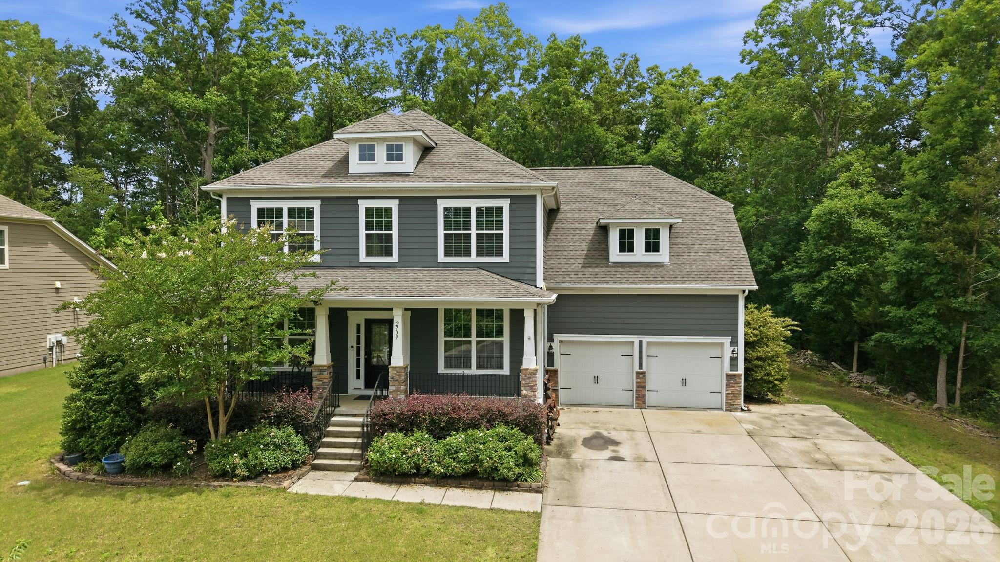 Beautifully designed 5 bedroom, 3.5 bath home tucked away on a quiet cul-de-sac in sought-after Waxhaw, NC. This desirable floor plan offers the flexibility today’s buyers are searching for, including a guest bedroom and full bath on the main level that works well for visitors, multigenerational living, or a private home office setup. Spacious living areas flow seamlessly for everyday living and entertaining, while the screened porch, sandstone paver patio, firepit, and hot tub create the perfect place to relax and unwind year-round. Thoughtful outdoor upgrades include wraparound landscaping, raised garden beds, irrigation covering the entire yard, storage shed, and Invisible Fence 360 wiring surrounding the backyard, both sides of the home, and part of the front yard for convenient pet containment.

Inside, the home features numerous updates including new luxury vinyl plank flooring installed in 2026, a tankless water heater, new AC unit in 2024 with app-controlled thermostat, app-controlled garage door openers, fresh interior paint in select rooms, built-in office shelving, custom pantry organization, and built-in shelving and drawers in the primary closet. The garage loft storage nearly doubles storage capacity, while the extended driveway provides additional parking for guests and everyday convenience.

Upstairs, the expansive primary suite provides a private retreat along with generously sized secondary bedrooms and versatile bonus space. Enjoy added privacy with no neighbors on two sides of the property and direct proximity to the nearby school campus and frisbee golf course. Residents also enjoy access to the neighborhood pool in this section of the community, along with two additional pools across the street, clubhouse, sport courts, playground, and more.

Convenient access to Historic Downtown Waxhaw, Ballantyne, Waverly, Rea Farms, I-485, and major commuter routes makes it easy to enjoy everything South Charlotte and Union County have to offer. Located near highly rated schools, shopping, dining, parks, and recreation, this move-in ready Waxhaw home combines comfort, functionality, and location in one exceptional opportunity.