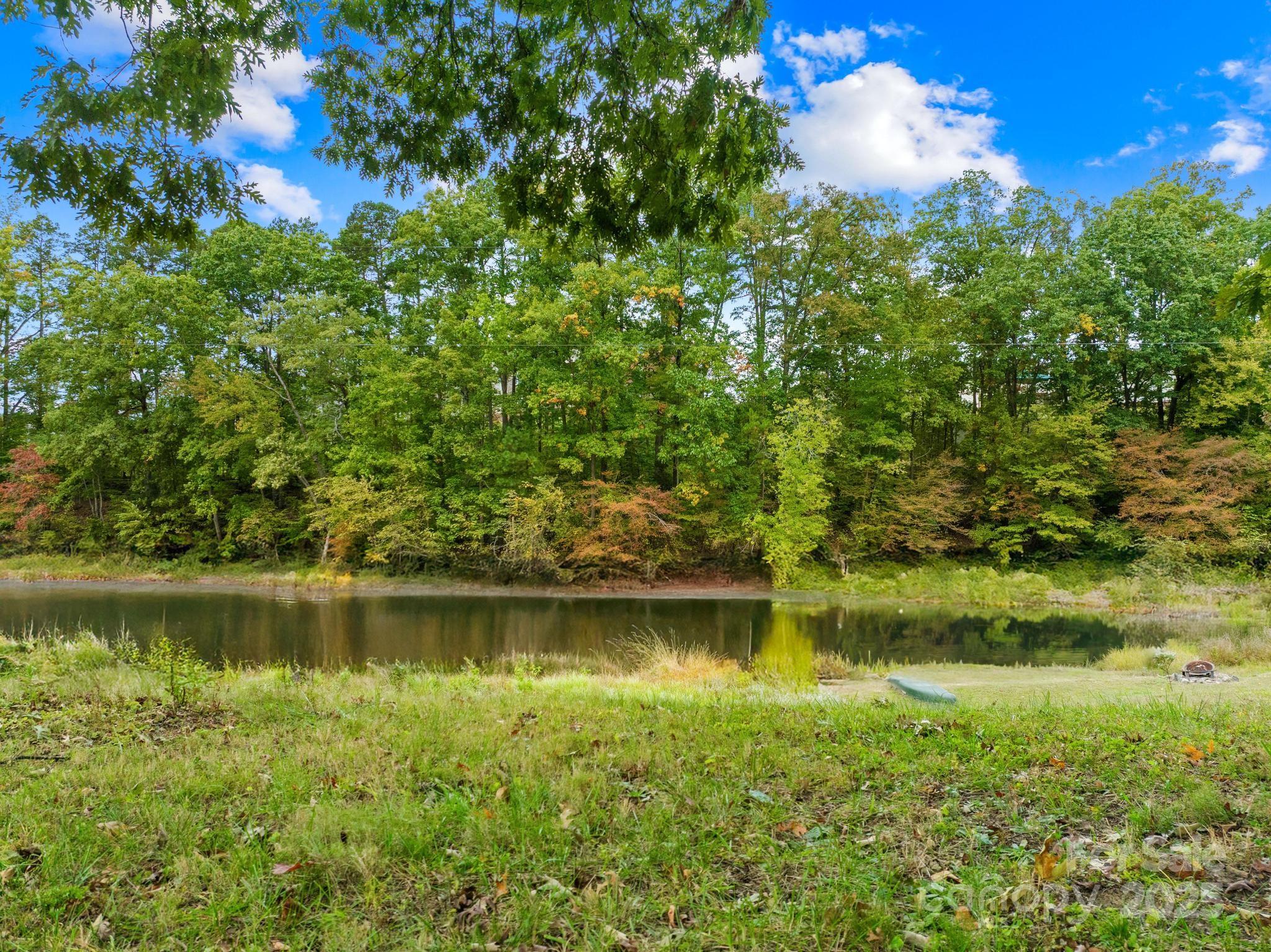 This gently sloping waterfront lot with almost half acres is in one the Lake Norman's hottest new areas. A shallow water cove for peaceful enjoyment and you are minutes from NEW shopping and dining @ The Villages of Sherrills Ford. This lot is READY to build on. New septic permit for a 3BR home has been applied for (see attachments). Level lot with a few trees and well is installed. Bring your plans and get ready to build.