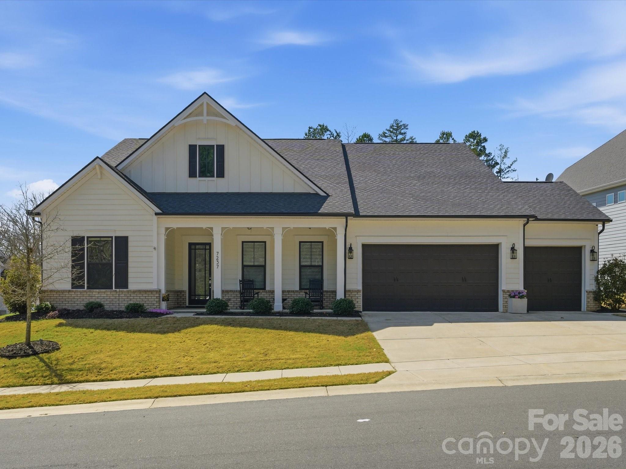 Stunning one-story home situated on a premium corner lot in the highly desirable Bent Creek community. Enjoy access to exceptional neighborhood amenities and a prime location just minutes from Indian Land’s newest Costco and Target. Thoughtfully designed with a modern transitional style, this home showcases exceptional upgrades and custom finishes throughout. Inside, you’ll find 10-foot ceilings, 8-foot solid core doors, quartz countertops, and a bright open layout. The kitchen features a KitchenAid appliance package, double ovens, a custom pantry, and an upgraded drop zone with cabinetry and wine fridge. The spacious primary suite offers a spa-like bath with an oversized walk-in shower and dual shower heads. Enjoy seamless indoor-outdoor living with a heated four-season room, covered pergola, and extended patio with an in-ground fire pit and built-in outdoor kitchen. A fully insulated three-car garage with heating, cooling, upgraded flooring, and built-in cabinetry adds year-round versatility. A rare opportunity to own a beautifully upgraded home just minutes from Ballantyne, Waxhaw, and Indian Land’s top-rated schools. Don't miss this one!