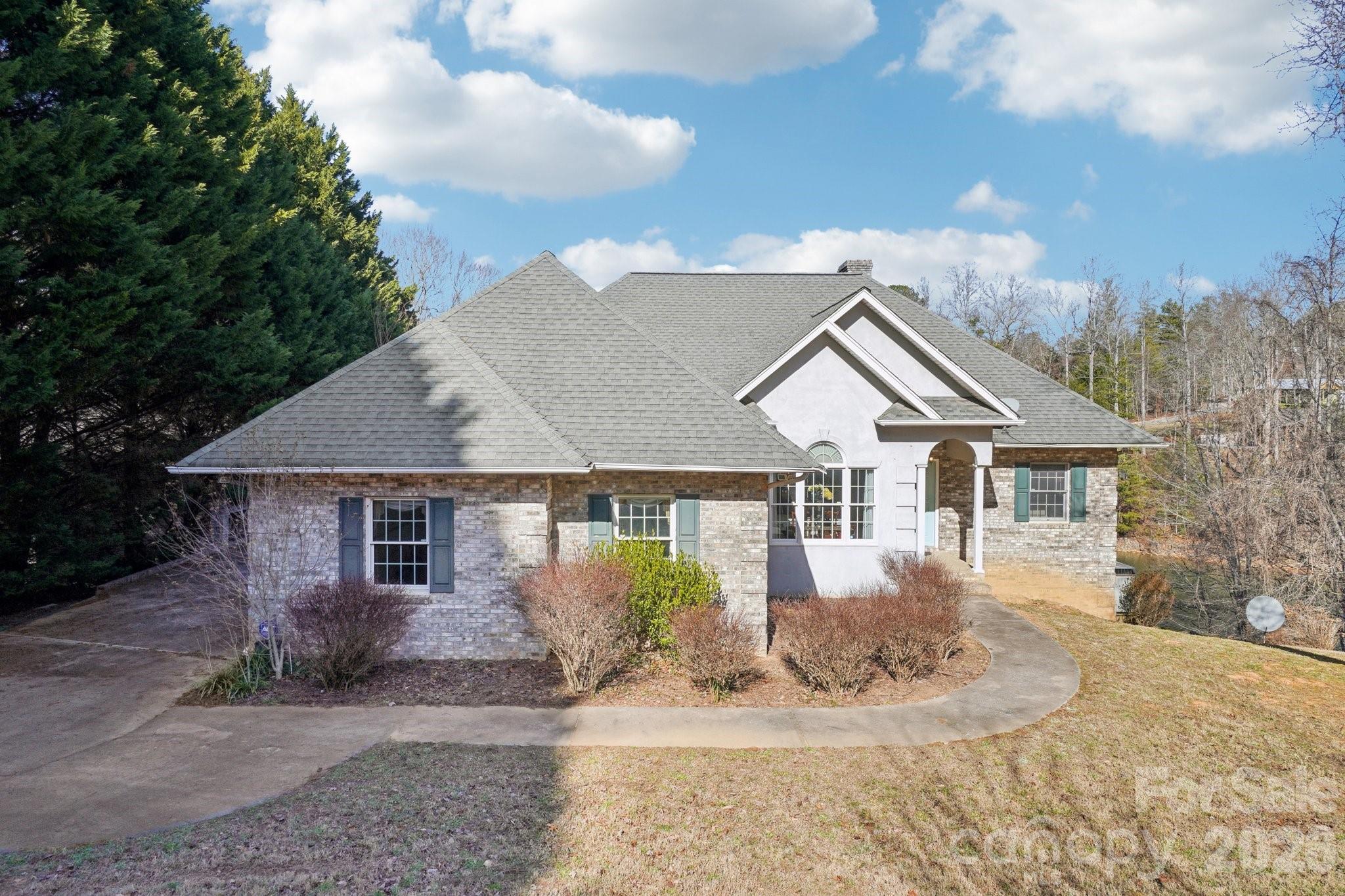Welcome to 4634 Harbor View Terrace! This beautifully appointed ranch-style lakefront home offers true main-level living with a finished lower level, blending comfort, space, and exceptional lake views. Featuring three bedrooms (all on main level) and three full bathrooms, the home showcases a mix of hardwood and carpeted floors along with two inviting fireplaces—one in the main living room and another in the lower-level den—creating warm gathering spaces on both levels.

The main level includes a dedicated dining room, a spacious kitchen with granite countertops, ample cabinetry, and a charming breakfast nook, all designed to take advantage of the home’s scenic setting. The primary suite serves as a private retreat with lake views, a walk-in closet, a walk-in shower, and a relaxing whirlpool tub, along with private access to the lake-facing deck—perfect for morning coffee or evening sunsets. The finished lower level expands the living space with a bar, an additional bedroom, and a den centered around the second fireplace, with direct exterior access to the lakefront, along with an unfinished bonus room offering generous storage or the opportunity for customization.

Step outside to enjoy three expansive lake-facing decks with clear, unobstructed water views—a rare feature no longer permitted on many newer lakefront lots. Nearly every room in the home enjoys a lake view, with the exception of the dining room and one secondary bedroom. Positioned on a wide, protected cove, the property offers beautiful open water views without the disruption of heavy boat traffic, creating a peaceful and enjoyable lakefront experience.

Whether swimming in the lake or the neighborhood pool, playing tennis, or heading out on the water, this home delivers the ultimate lake lifestyle. A boat slip is included, making it easy to enjoy everything the lake has to offer.

*Take a look at the drone video in agent remarks!*