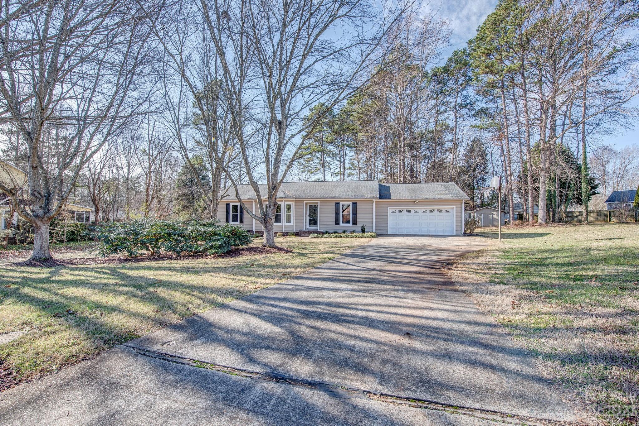 Great location close to shopping, Cramerton and Belmont on large cul-de-sac lot. Recent updates include windows, interior doors. flooring, appliances, lighting, plumbing fixtures and granite countertops. Primary bath has walk in shower and separate vanities. 12x16 deck overlooks back yard with large wooded area. HVAC 4 years old.