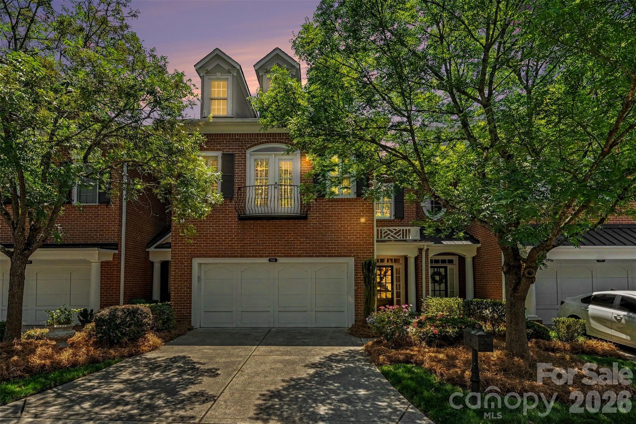 Stunning full-brick luxury townhome with attached 2-car garage in The Magnolias, an exclusive gated community just a short walk to the Arboretum. Built by renowned builder John Weiland, this beautifully updated home showcases upscale finishes throughout, including 10-foot ceilings, 8-foot doors, extensive crown molding, elegant architectural details, and hardwood flooring throughout all three floors (2024). The grand foyer opens to a sophisticated dining room featuring a tray ceiling and custom molding. The spacious kitchen is equipped with newer stainless steel appliances, including a wine refrigerator, and flows seamlessly to a private rear courtyard—perfect for relaxing or entertaining. Upstairs, the oversized primary suite offers two large walk-in closets and a luxurious retreat feel. Two generously sized secondary bedrooms, each with walk-in closets, share a well-appointed full bath.
The finished third floor provides a versatile bonus room ideal for a media room, office, gym, or guest space, along with additional walk-in storage. Extensive recent updates include a new roof (2022), HVAC system (2017), and new water heater, disposal, washer & dryer, garage door panel, and louvered shutters (all 2025). Interior walls and ceilings were freshly painted in 2026. Move-in ready and ideally located near premier shopping, dining, and everyday conveniences. HOA Covers: Home Insurance, Water & Sewer, most exterior repairs, lawn and maintenance, street lighting and road and gate maintenance.