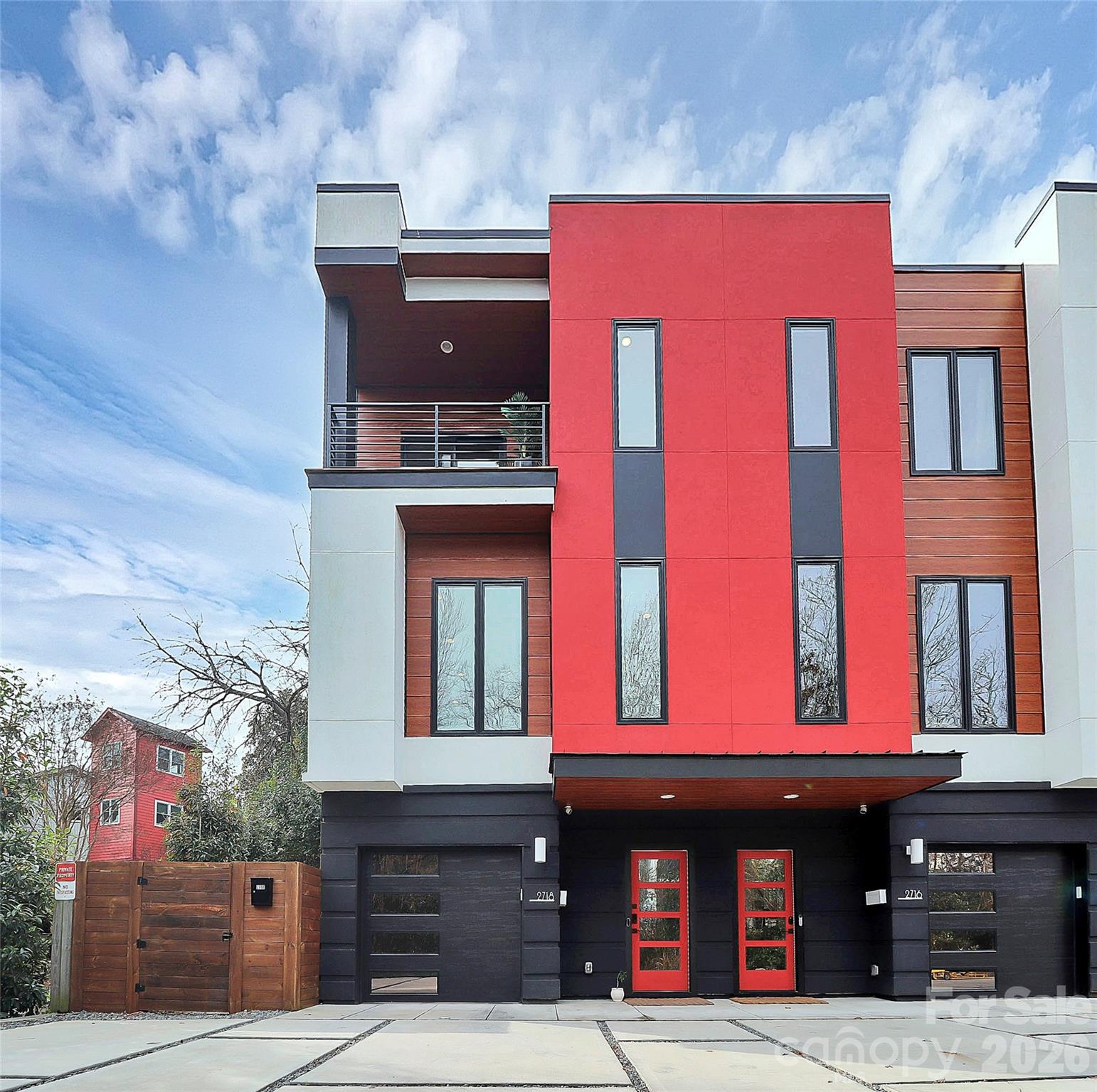 Price reduced on this amazing value for ultra luxurious and modern living!  LUX NoDa is an exclusive enclave of thoughtfully designed true town homes located in the heart of NoDa’s vibrant pedestrian district. Far from the typical cookie-cutter design, these architecturally distinctive homes blend modern luxury with artistic charm....from the permeable driveways to the striking exterior details.

This light-filled end unit offers exceptional natural light throughout all levels. The entry level features a spacious garage, additional reserved parking directly in front, and a welcoming hallway leading to a private guest suite complete with a full bath, included murphy bed and access to the cozy backyard.

Upstairs, the main living level was designed for both comfort and entertaining. The expansive living room features an electric fireplace and designer wall treatments, while the chef’s kitchen impresses with an induction cooktop, custom backsplash, oversized island and abundant cabinetry.

The upper level is where this home truly stands out. Surrounded by treetop views, the primary suite feels like a private penthouse retreat, complete with dual closets and its own balcony! The spa-inspired bath features soaring ceilings, abundant natural light, and a luxurious wet room with soaking tub and shower beneath a stunning skylight.

All of this in one of Charlotte’s most sought-after neighborhoods, just steps from NoDa’s best restaurants, bars, boutiques, entertainment, light rail access, and only two blocks from the Y. Low HOA dues complete the package. Schedule your showing today!