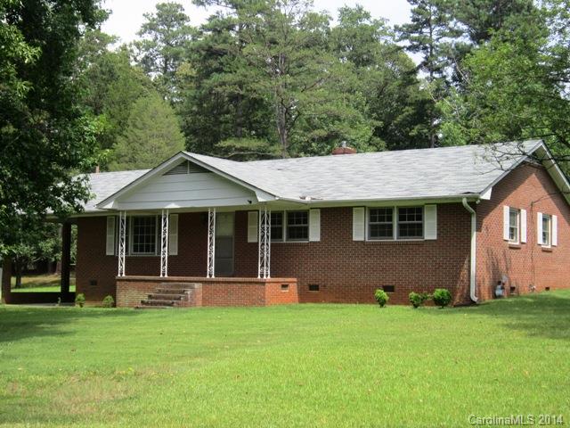 Custom built 2 + acres, 1 owner home, outside city limits! All brick exterior w/covered front porch & attached carport plus utility room. All this w/HW floors in Living/Dining room, hallway & 3 BD's. Also, ceramic tile in both baths & new carport & tile in kitchen & den. New gas H&A systems and new roof. Cal ltoday for appt. Hurry on this one! Over 1800 sq ft and 2+ acres