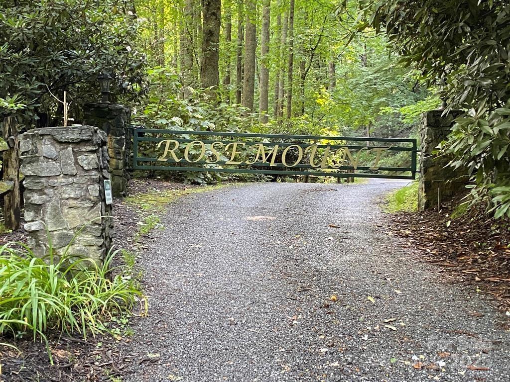 Almost 2 acres in the lovely gated Cottages at Rosemount Community. This property is conveniently located near Balsam Gap between Sylva and Waynesville. Native flora and fauna adorn the property not to mention the cooler temperature at an elevation of 3700'. Excellent opportunity to build your dream home in this natural wonderland only minutes to hospitals, shopping and dining. Ask about owner financing.