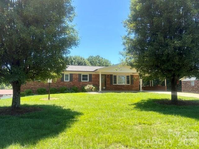 Great Location in Downtown Hudson!

This beautifully maintained 4-bedroom, 3-bath brick ranch offers the perfect combination of location, updates, and move-in-ready condition. Featuring an all-brick exterior and a brand-new roof, this home has undergone extensive remodeling and is ready for its next owner.

Relax on the welcoming covered front porch, with plenty of space for outdoor furniture—perfect for enjoying a glass of iced tea on warm summer evenings.

Recent improvements include fresh interior paint, updated light fixtures, newer appliances, replacement windows, and updated interior doors. The kitchen shines with a new sink and faucet, complemented by modern appliances and abundant workspace.

The main level features wood and luxury vinyl plank flooring throughout, while the lower level has been freshly painted and finished with LVP flooring. Downstairs, you'll find a spacious den/recreation room, ideal for relaxing, entertaining, a game room, home gym, or media area. The basement also includes a fourth bedroom and full bath, providing excellent space for guests or extended family.

The unfinished basement area offers a single-car garage, perfect for vehicle storage, lawn equipment, or a workshop space. Outside, you'll appreciate the fenced backyard, providing privacy and room for pets, play, or gardening.

Main level and basement laundry areas!

Conveniently located near shopping, dining, schools, and downtown Hudson amenities, this home is a must-see.

Contact the listing agent for any additional material facts and information.