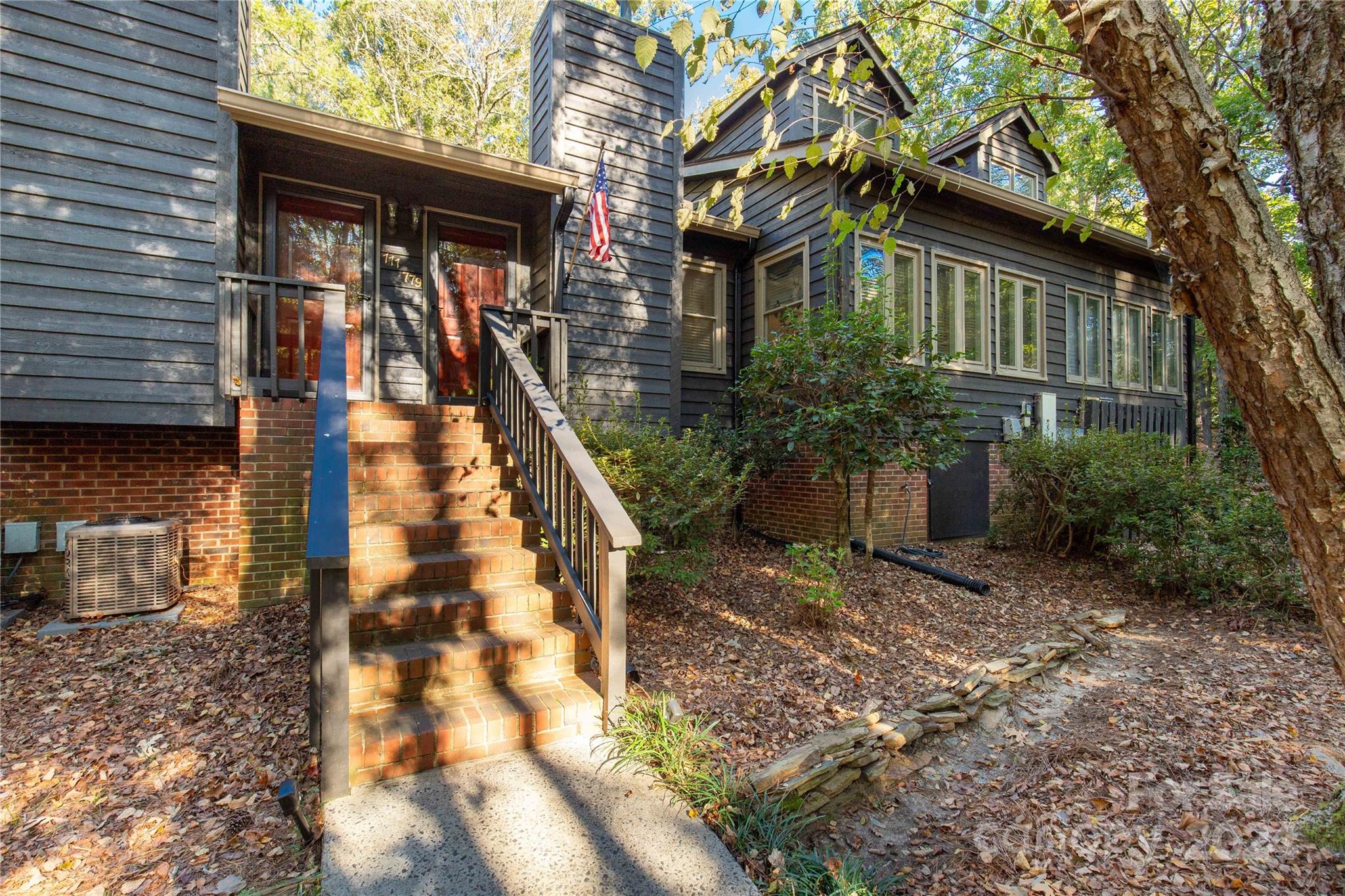 Welcome to Cross Creek.  This home offers so much!  Hardwood floors through the living areas, a roomy main level primary bedroom with a wonderful sitting room.  The kitchen offers a gas range and hood, work island and breakfast nook that overlooks a private deck with a tilt-out awning for added shade.  The sitting room/library offers a private retreat while the upstairs bedrooms offer ample storage in both the closets as well as attic storage and a shared bathroom.  1 car garage plus there's a community pool.