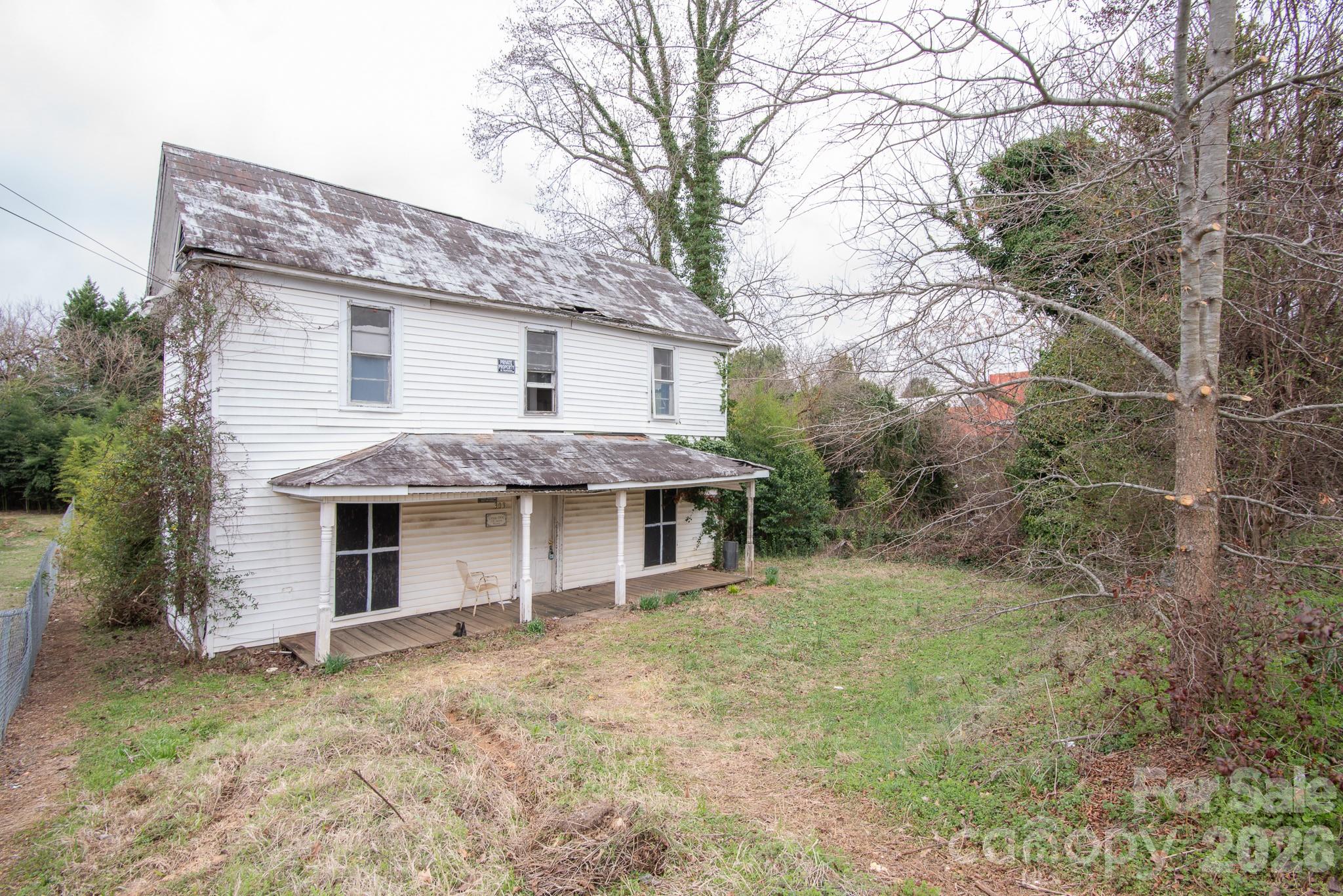 INVESTOR SPECIAL - SELLER FINANCING OFFERED! Circa 1900, the historic C.H. Swink House presents a rare opportunity for the right buyer with vision and a passion for restoration. This two-story home offers approximately 1,911 square feet and serves as a true blank canvas, requiring substantial renovation to bring it back to life. Situated beside the railroad tracks and close proximity from downtown amenities, including restaurants, shopping, and more, this property holds potential for those ready to transform a piece of history into something special.  Located in Brooklyn South Square Historic District.  No preservation agreement with Historic Salisbury Foundation, just requirements with City (no approvals needed for interior changes).