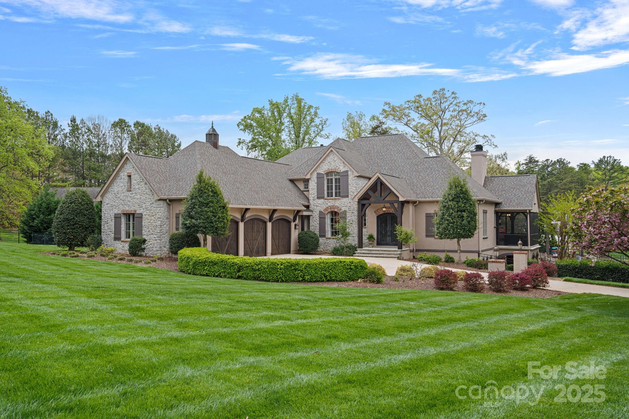 Waterfront Arcadia custom built home offers Resort like amenities in addition to the quality construction & finishes. The home has optimal Privacy on 1.28 acres & lives comfortably. Heated salt water pool with hot tub, fire pit & Kitchen Cabana creates an outdoor oasis. Clarkhall entry doors to two story Foyer & Great Room gives gas log fireplace, lakeside access to Screened Porch with Fireplace & balcony patio. Gourmet Kitchen offers Thermodor Gas Range, new dishwasher, SubZero Fridge. Recently refinished cabinetry, tiled backsplash & hardware. Scullery with Fridge, Icemaker, Wall Oven & prep sink. Primary on Main has see thru gas log fireplace to large Spa Bath. Upper level has 3 NEW Ensuite Baths for each Bedroom. Bedrooms will accommodate large furniture. Basement: Bar, Billiard, Media, Wine, and Gym. Bedroom 5 and Full Bath down. All NEW carpeting, stair runners & full interior painting & Lighting updates. Shared dock-Deeded Boat Slip with Lift & 2 PWC jet ports in the backyard.