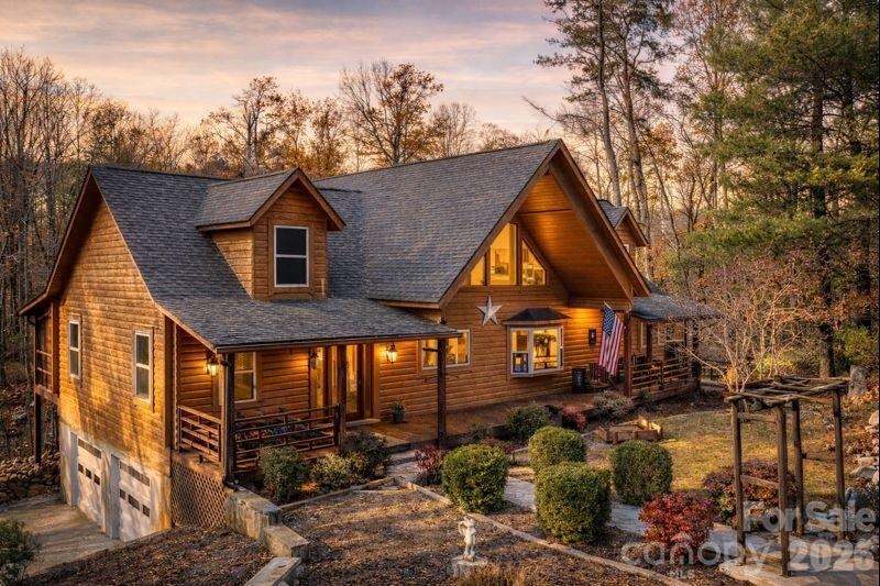 Price Adjustment! Now $509,900! Perfectly secluded with a perfect blend of rustic charm and modern appeal. 143 Rosewood Ln is a 2988 heated sq ft log home sitting on 5.12 acres, consisting of 2 main level bedrooms, 1 bed in the basement and 2 full bathrooms on the main level. The blend of log, wood and painted drywall cause this home to feel open and expansive. Speaking of that, the vaulted great room with loft and wood burning fireplace is expansive as well. Large, covered and screened porches extend across the front and rear of the home giving ample outdoor living space for those beautiful foothills days. The logs were recently re-stained in 2024. Pergo flooring installed in main living areas in 2024. Granite kitchen counters installed in 2025. Two water heaters replaced in 2019 and a toilet added downstairs in 2019 in an area that could be finished out for a full bathroom.