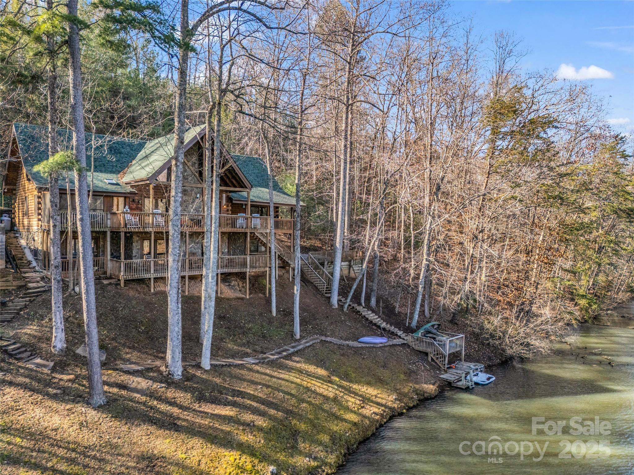 Nestled on the peaceful shores of Mirror Lake in Riverbend at Lake Lure, this expansive 4,000+ sq ft log cabin offers the perfect blend of relaxation, recreation, and income potential. With five dedicated sleeping areas plus generous overflow space, it’s ideal for large family retreats or a high-performing vacation rental—producing an impressive $171,000 in 2023. Wake up to serene lake views, spend your days fishing, swimming, kayaking, or hiking right outside your door, and enjoy evenings exploring nearby Chimney Rock Village or the renowned Tryon Equestrian Center. Designed for comfort and connection, this inviting mountain retreat provides room to gather, unwind, and make lasting memories. Whether you’re seeking a proven investment opportunity or a peaceful escape surrounded by nature, this lakeside log home delivers an exceptional lifestyle in one of the most sought after areas in WNC.
