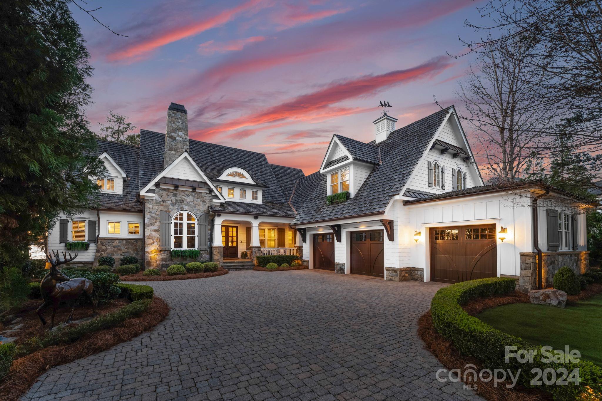 Introducing "Sunset Serenity!" Your dream waterfront retreat on Lake Norman! This exquisite custom-built home by Kingswood Custom Homes, offers unparalleled luxury & privacy on a serene cul-de-sac lot spanning .96 acres. You'll be greeted by the warmth of wood floors throughout, complemented by the inviting ambiance of 4 fireplaces strategically placed for cozy evenings. Entertaining is a delight in the custom-designed kitchen featuring high-end appliances & meticulous attention to detail. The expansive living spaces seamlessly flow to the outdoors, where panoramic views of stunning sunsets over LKN await you. Outdoor enthusiasts will revel in the 400ft of water frontage, complete w/private dock, private beach, custom pool w/multiple waterfalls & covered patio equipped w/automatic screens, built in wet bar & Viking grill ensuring memorable moments w/family & friends; a backdrop of nature's beauty where paradise & luxury meet natural splendor, offering the ultimate waterfront lifestyle.