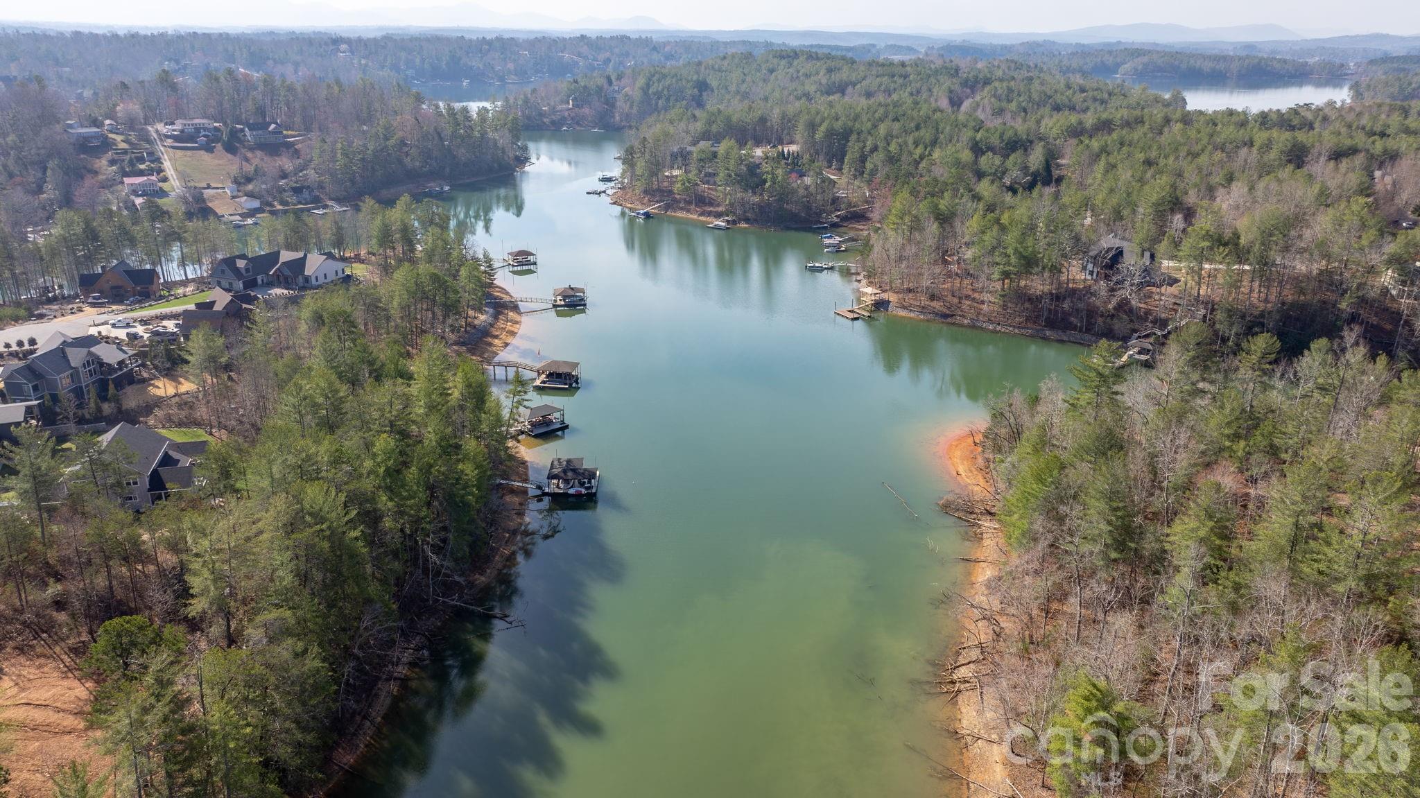 Build your dream home in one of the most exciting up-and-coming communities near Lake James. In close proximity to the lake shore, 3030 Channel View Cove. 
offers a rare opportunity to own a level, easy-to-build homesite in a neighborhood experiencing fresh momentum with
brand-new construction underway. Enjoy the lifestyle that makes this area so desirable—private beach access to Lake
James, perfect for swimming, kayaking, or simply unwinding by the water. Whether you’re envisioning a full-time residence
or a serene mountain-lake retreat, this lot provides a versatile and builder-friendly foundation. Surrounded by new homes
and thoughtful development, this community blends natural beauty with modern growth—making it an ideal investment for
today and the future. Don’t miss your chance to be part of a growing neighborhood where lake living meets new
construction energy. Lake James Community at Waters Edge. Community has Lake Access, beach access, fire pit area,
walking trails, Short term rentals allowed.