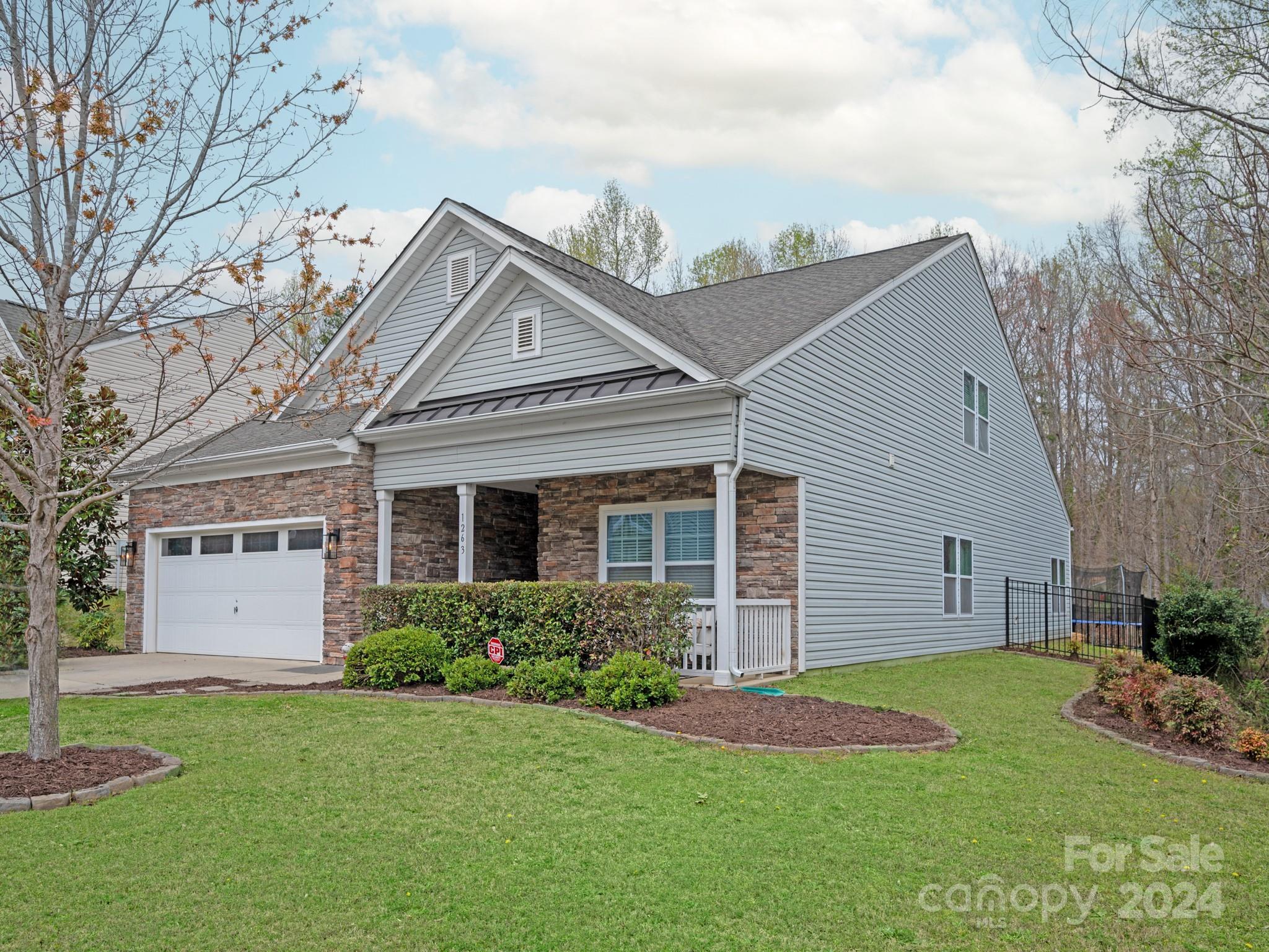 Wonderful opportunity for this stunning 1.5 story home located in the Oaks At Clover. This 3 bed 3 bath home features new LVP flooring on main, oversized gourmet style kitchen with large kitchen island, primary suite on the main features sitting / office area, walk in closet, dual vanities, enclosed shower with body jets and rain fall shower, a 2nd bedroom and 2nd full bathroom on main, walk-in laundry room, formal dining room, butlers pantry, oversized great room, eat-in breakfast area and more. Upstairs you'll find a large 3rd bedroom and full bath as well as an oversized loft / bonus area that could easily be converted into 2 additional bedrooms. Covered patio off the rear overlooking a private fenced yard, woods in the rear for privacy, and so much more!