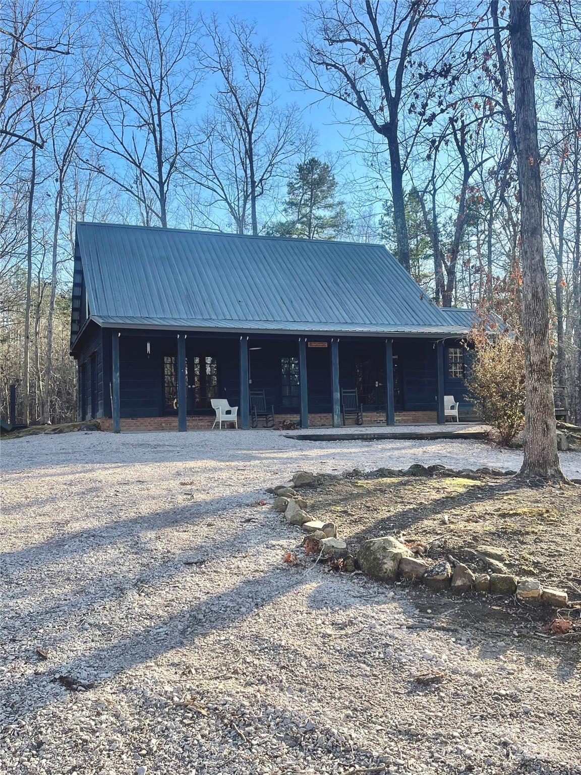 Super nice rustic hunting lodge, nice enough for your family to live in. Very private. Large new 3-door metal building. Tractor shed. Large creek. If you ever wanted a private family getaway, this is it. Shooting range and much, much more. An outdoor family dream property. Deer and Turkey abound. Great house on 98 acres of beautiful property. Call today to see this very special property.
